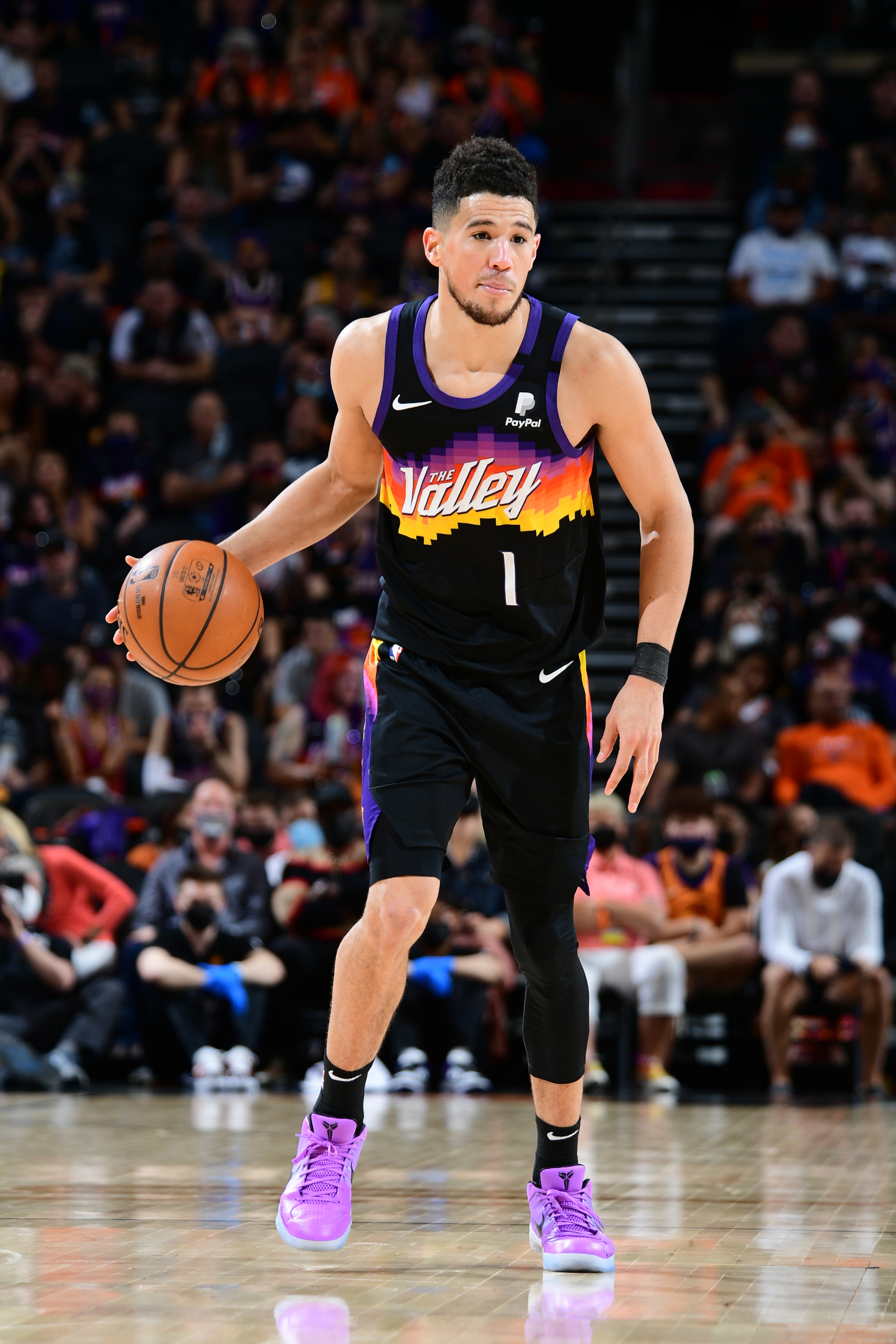 PHOENIX, AZ - MAY 23: Devin Booker #1 of the Phoenix Suns dribbles the ball against the Los Angeles Lakers during Round 1, Game 1 of the 2021 NBA Playoffs on May 23, 2021 at Phoenix Suns Arena in Phoenix, Arizona. NOTE TO USER: User expressly acknowledges and agrees that, by downloading and or using this photograph, user is consenting to the terms and conditions of the Getty Images License Agreement. Mandatory Copyright Notice: Copyright 2021 NBAE (Photo by Michael Gonzales/NBAE via Getty Images)
