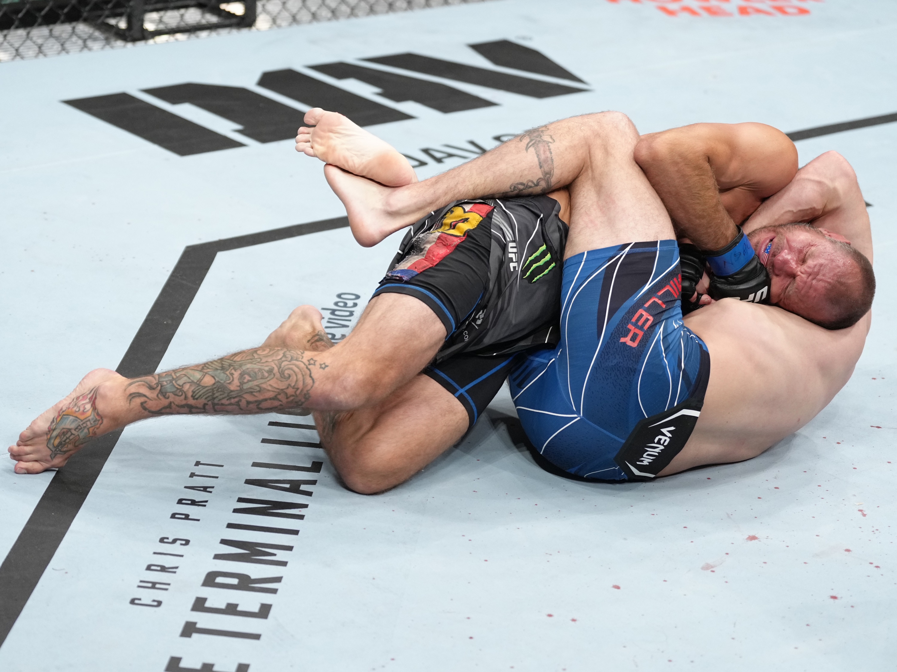 LAS VEGAS, NEVADA - JULY 02: Donald Cerrone defends a submission by Jim Miller in a welterweight fight during the UFC 276 event at T-Mobile Arena on July 02, 2022 in Las Vegas, Nevada. (Photo by Jeff Bottari/Zuffa LLC)