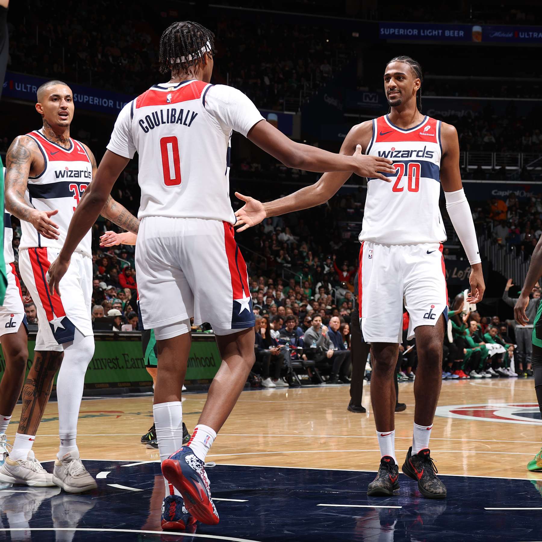 WASHINGTON, DC -  OCTOBER 24: Bilal Coulibaly #0 of the Washington Wizards high fives Alexandre Sarr #20 of the Washington Wizards during the game against the Boston Celtics on October 24, 2024 at Capital One Arena in Washington, DC. NOTE TO USER: User expressly acknowledges and agrees that, by downloading and or using this Photograph, user is consenting to the terms and conditions of the Getty Images License Agreement. Mandatory Copyright Notice: Copyright 2024 NBAE (Photo by Stephen Gosling/NBAE via Getty Images)