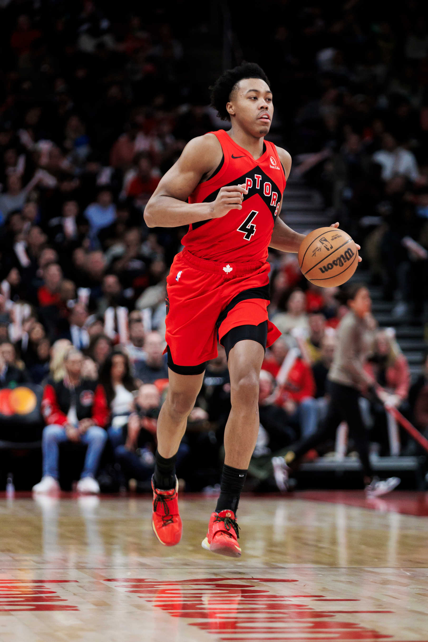 TORONTO, CANADA - FEBRUARY 28: Scottie Barnes #4 of the Toronto Raptors dribbles against the Dallas Mavericks second half of their NBA game at Scotiabank Arena on February 28, 2024 in Toronto, Canada. NOTE TO USER: User expressly acknowledges and agrees that, by downloading and or using this photograph, User is consenting to the terms and conditions of the Getty Images License Agreement. (Photo by Cole Burston/Getty Images)