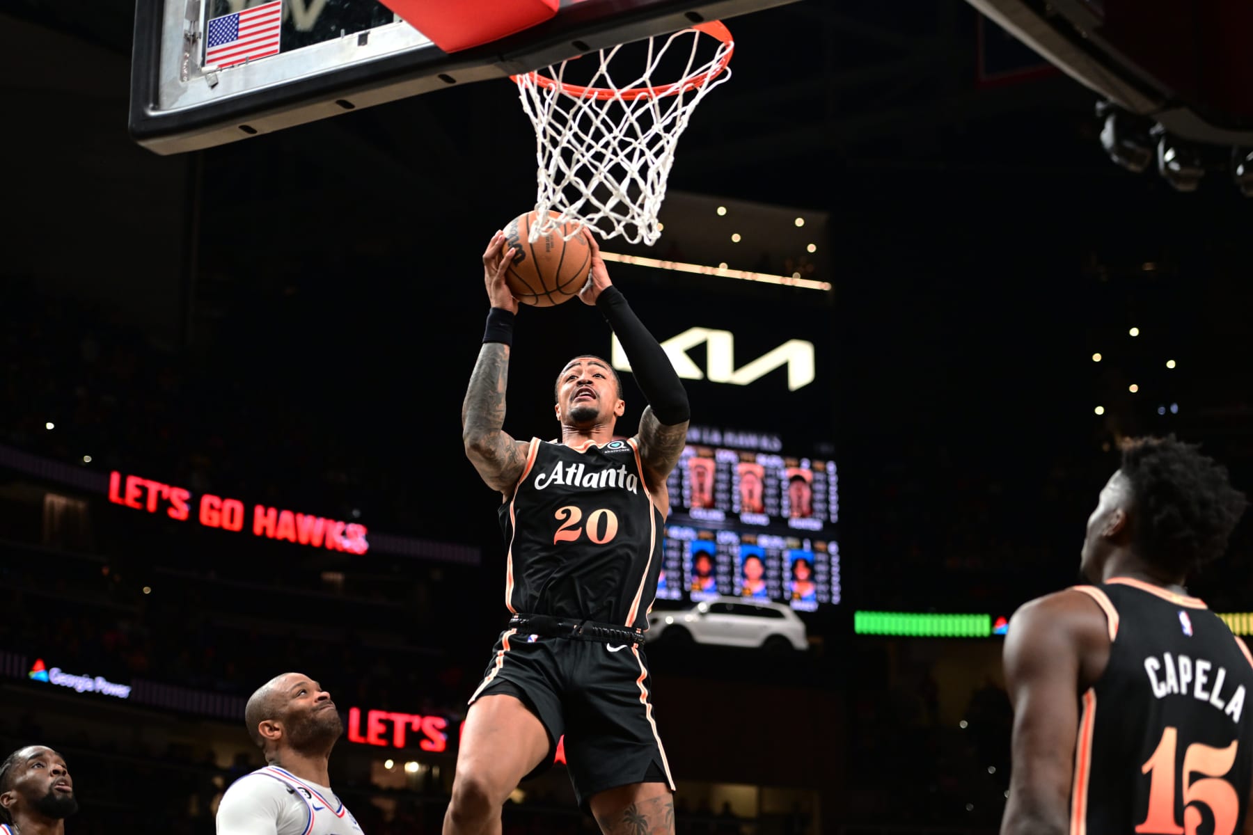 ATLANTA, GA - NOVEMBER 10: John Collins #20 of the Atlanta Hawks drives to the basket during the game against the Philadelphia 76ers on November 10, 2022 at State Farm Arena in Atlanta, Georgia.  NOTE TO USER: User expressly acknowledges and agrees that, by downloading and/or using this Photograph, user is consenting to the terms and conditions of the Getty Images License Agreement. Mandatory Copyright Notice: Copyright 2022 NBAE (Photo by Adam Hagy/NBAE via Getty Images)