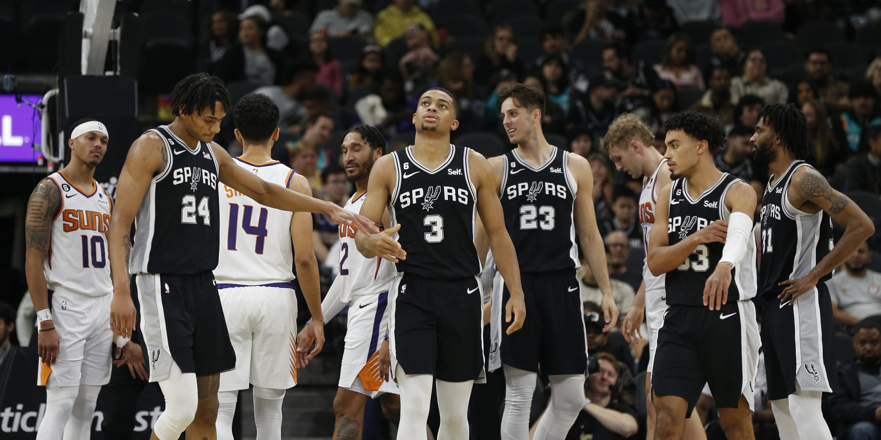 SAN ANTONIO, TX - DECEMBER 04: Devin Vassell #24 of the San Antonio Spurs congratulates Keldon Johnson #3 after a basket against the Phoenix Suns in the second half of the game at AT&T Center on December 4, 2022 in San Antonio, Texas. NOTE TO USER: User expressly acknowledges and agrees that, by downloading and or using this photograph, User is consenting to terms and conditions of the Getty Images License Agreement. (Photo by Ronald Cortes/Getty Images)