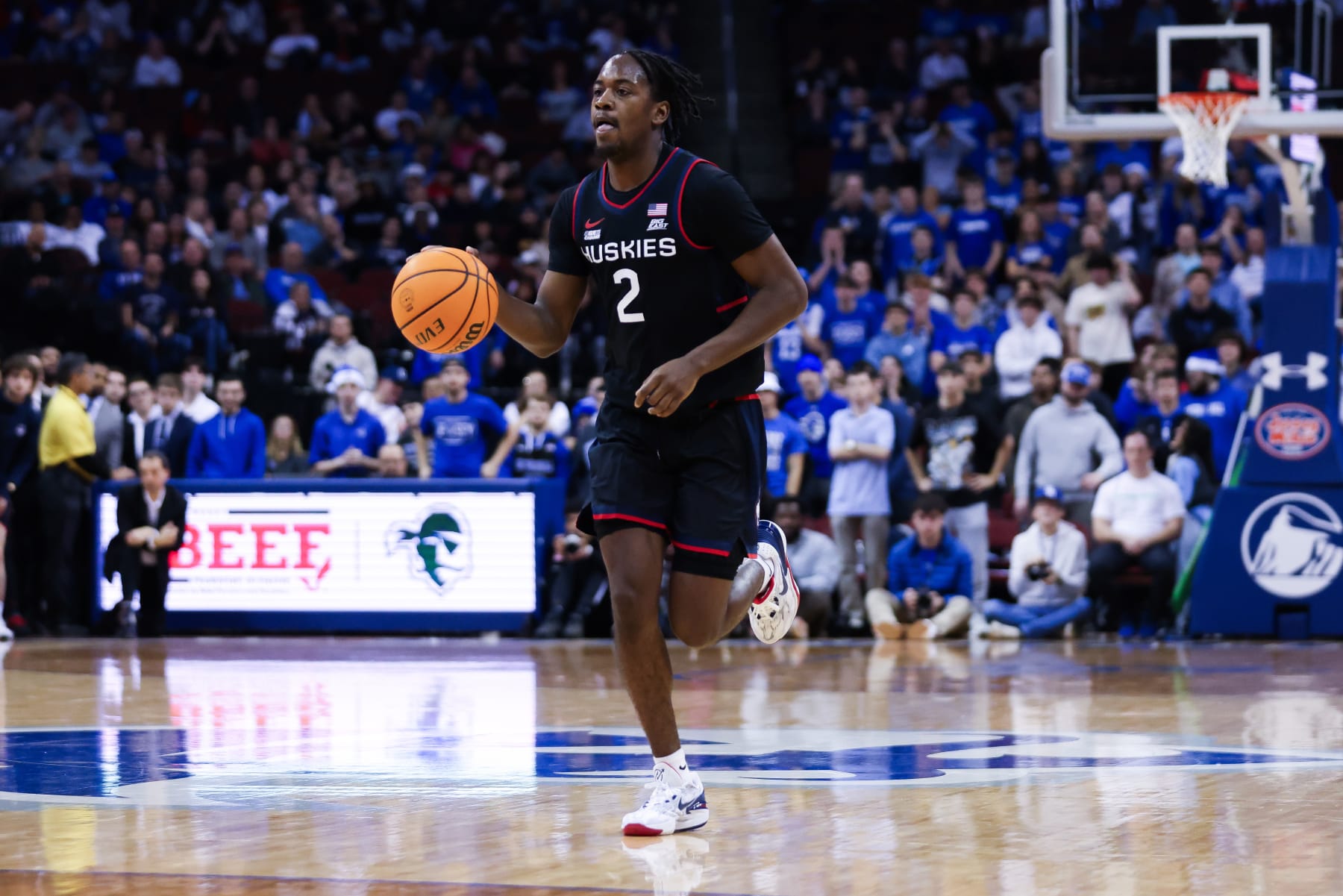 NEWARK, NJ - DECEMBER 20: Connecticut Huskies guard Tristen Newton (2) dribbles the ball during a game between the Connecticut Huskies and Seton Hall Pirates on December 20, 2023 at Prudential Center in the Newark, New Jersey. (Photo by Andrew Mordzynski/Icon Sportswire via Getty Images)