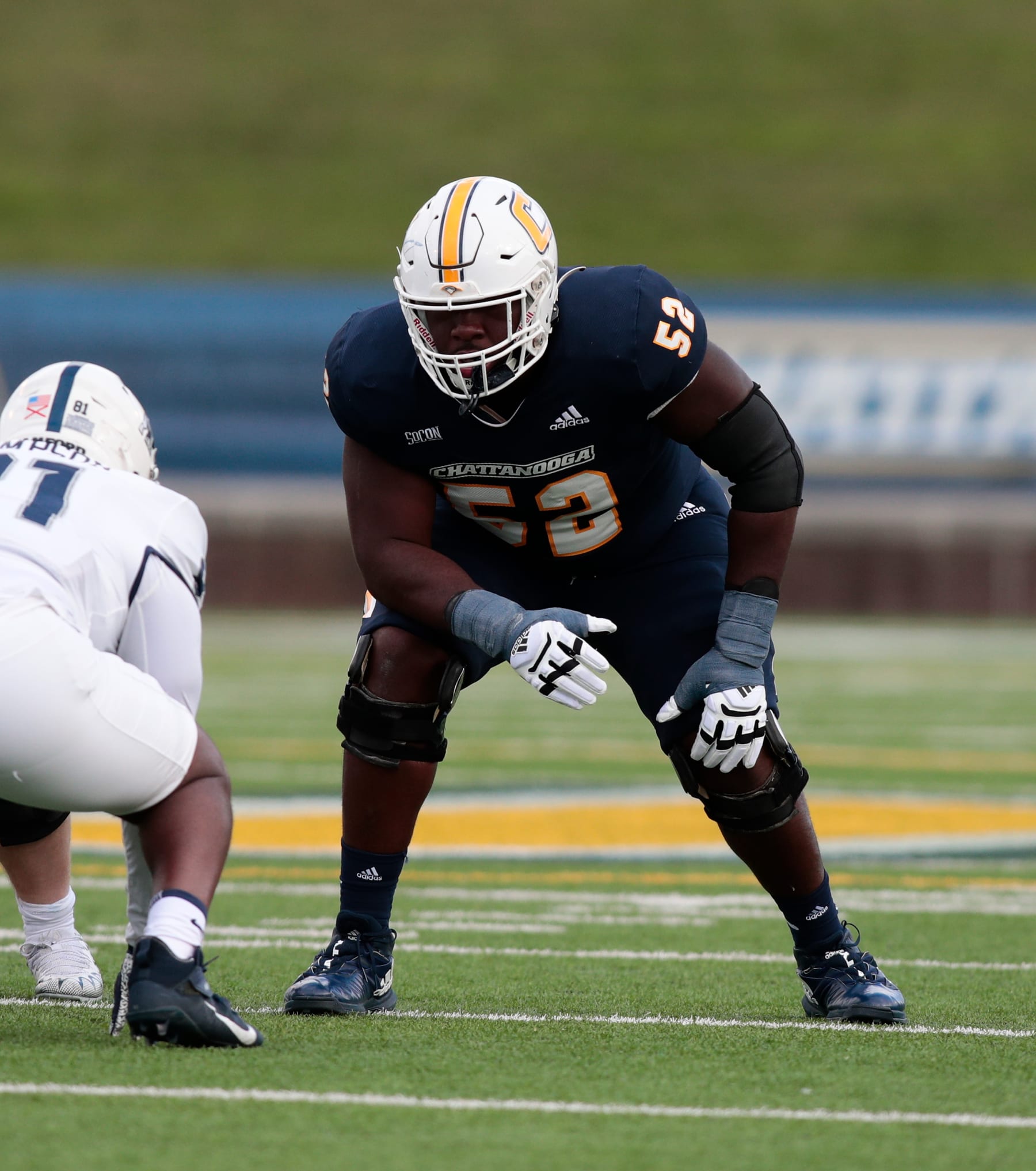CHATTANOOGA, TN - NOVEMBER 12: Chattanooga Mocs offensive lineman McClendon Curtis (52) waits for the ball to be snapped during the game between the Chattanooga Mocs and the Samford Bulldogs on November 12, 2022 at Finley stadium in Chattanooga, Tennessee.(Photo by Charles Mitchell/Icon Sportswire via Getty Images)