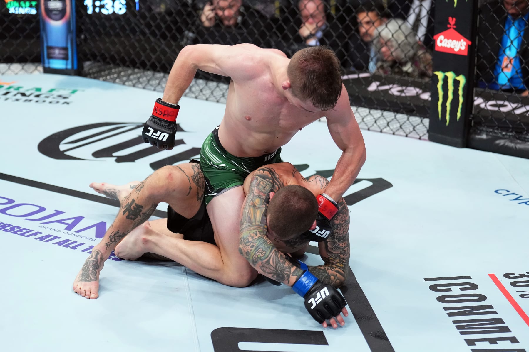 LAS VEGAS, NEVADA - DECEMBER 10: (L-R) Cameron Saaiman of South Africa punches Steven Koslow in a bantamweight fight during the UFC 282 event at T-Mobile Arena on December 10, 2022 in Las Vegas, Nevada. (Photo by Chris Unger/Zuffa LLC)