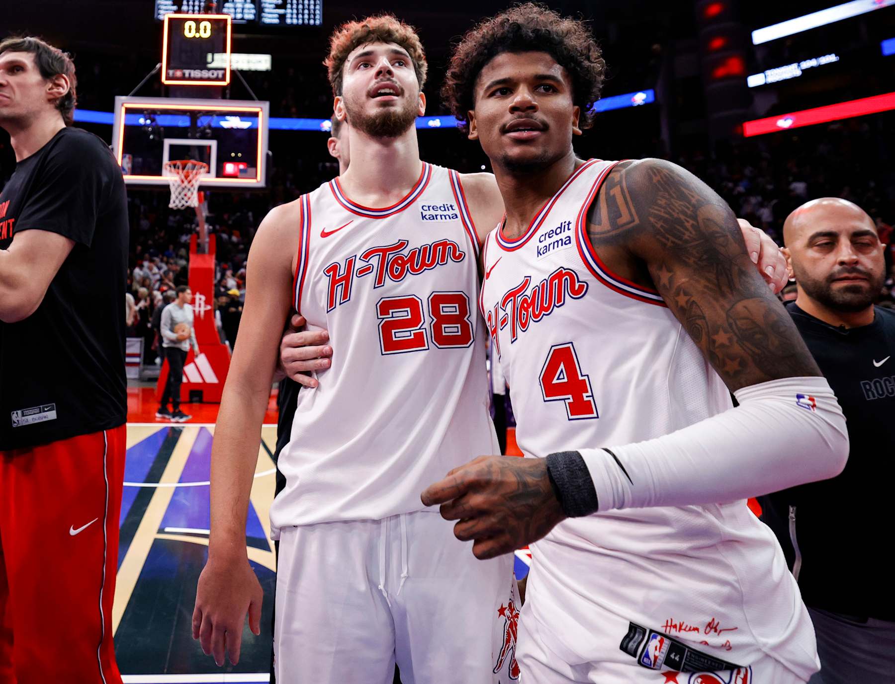HOUSTON, TEXAS - NOVEMBER 10: Alperen Sengun #28 of the Houston Rockets hugs Jalen Green #4 after defeating the New Orleans Pelicans 104-101 at Toyota Center on November 10, 2023 in Houston, Texas. NOTE TO USER: User expressly acknowledges and agrees that, by downloading and or using this photograph, User is consenting to the terms and conditions of the Getty Images License Agreement.  (Photo by Carmen Mandato/Getty Images)