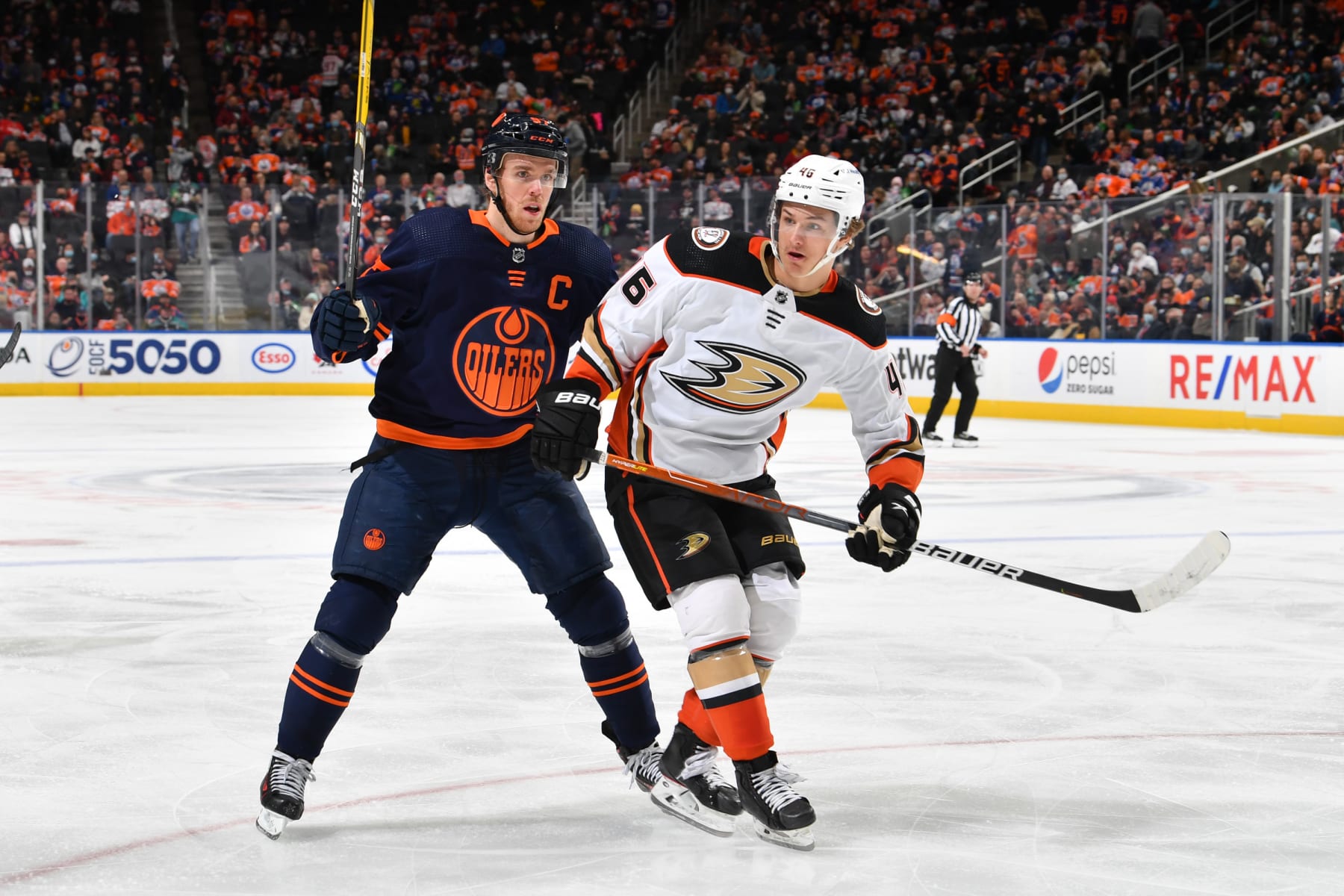 EDMONTON, AB - FEBRUARY 17: Connor McDavid #97 of the Edmonton Oilers battles for the puck against Trevor Zegras #46 of the Anaheim Ducks on February 17, 2022 at Rogers Place in Edmonton, Alberta, Canada. (Photo by Andy Devlin/NHLI via Getty Images)