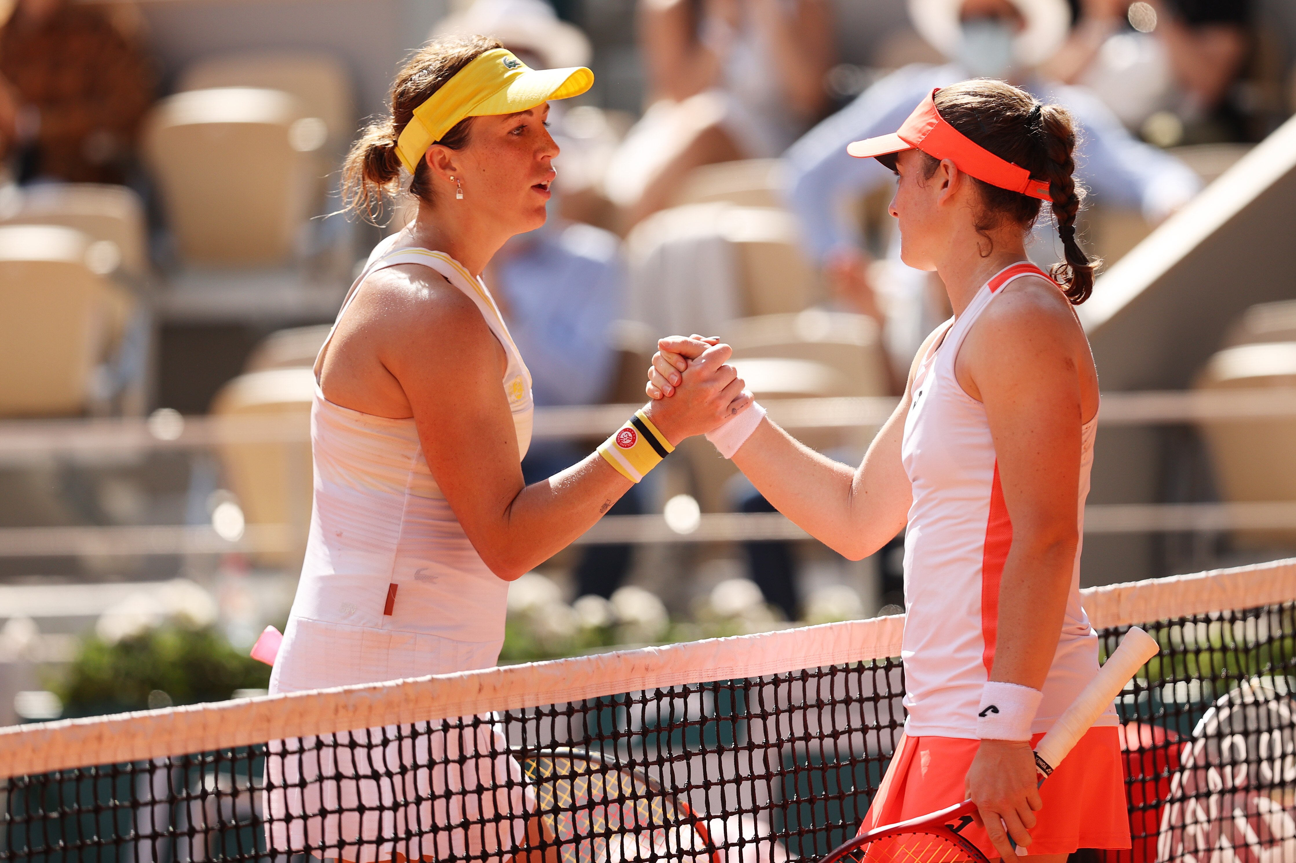 PARIS, FRANCE - JUNE 10: Tamara Zidansek of Slovenia and Anastasia Pavlyuchenkova of Russia shake hands at the net after their Semi-Final Women's Singles match during Day Twelve of the 2021 French Open at Roland Garros on June 10, 2021 in Paris, France. (Photo by Clive Brunskill/Getty Images)
