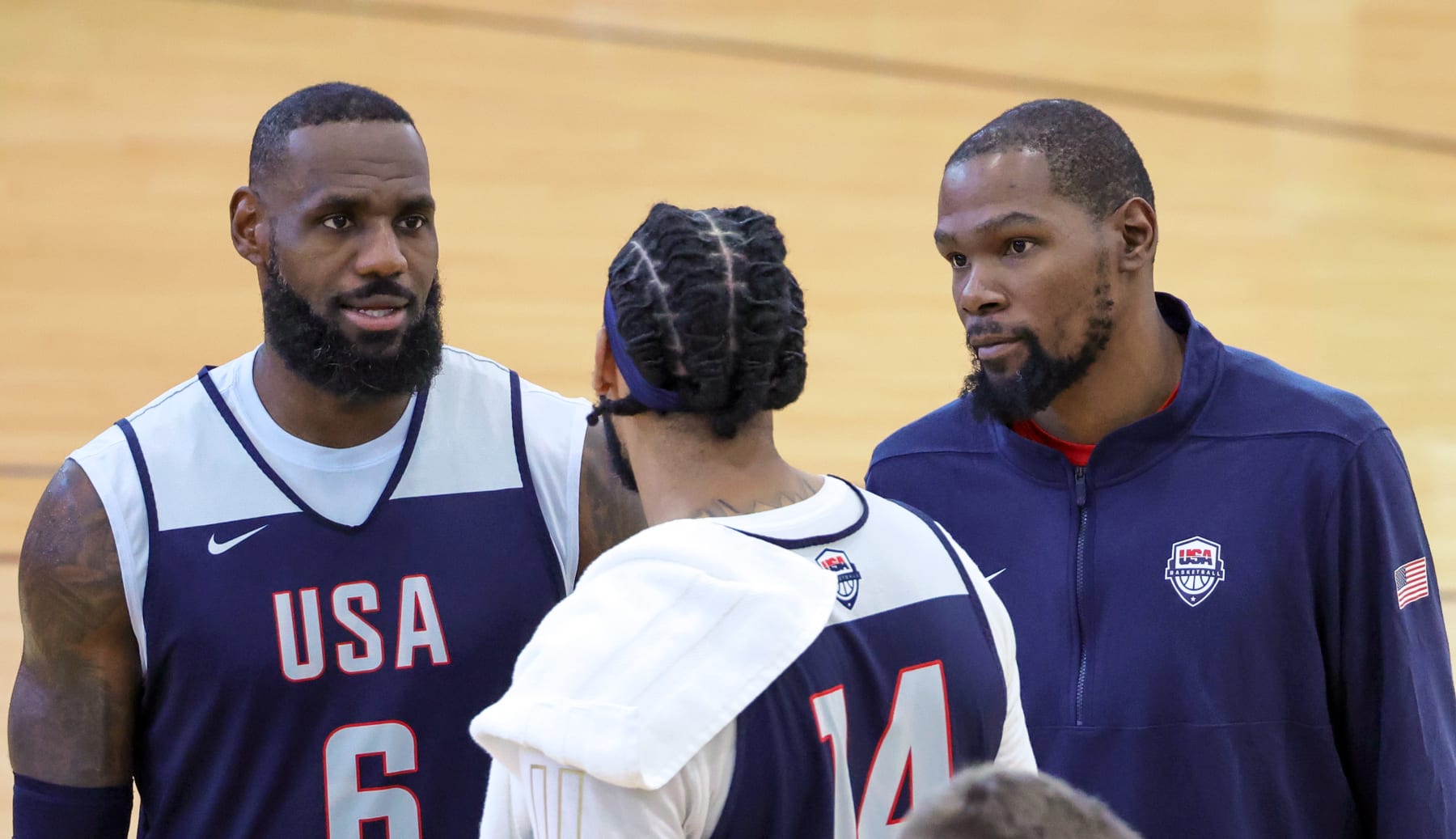 LAS VEGAS, NEVADA - JULY 07: LeBron James #6, Anthony Davis #14 and Kevin Durant #7 of the 2024 USA Basketball Men's National Team talk during a practice session at the team's training camp at the Mendenhall Center at UNLV on July 07, 2024 in Las Vegas, Nevada. (Photo by Ethan Miller/Getty Images)