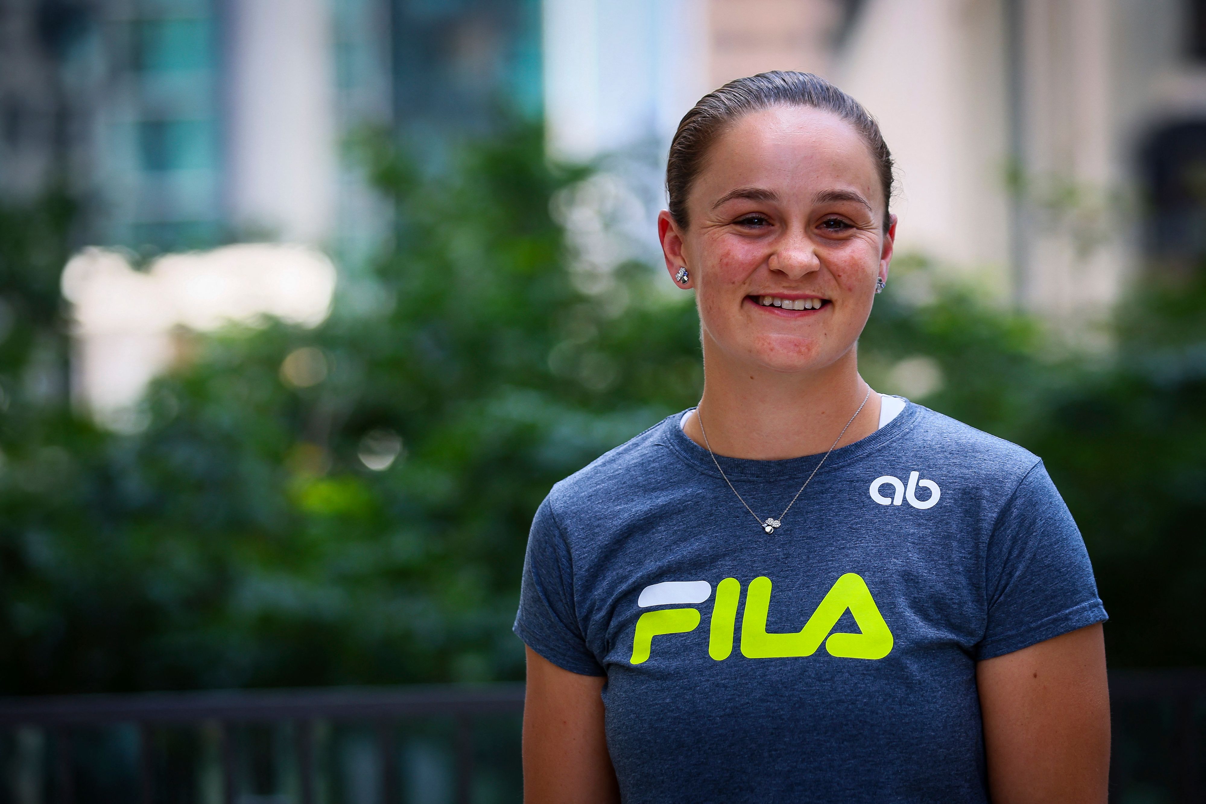 Australia's Ashleigh Barty smiles during a press conference in Brisbane on March 24, 2022, after she announced her retirement from tennis. - IMAGE RESTRICTED TO EDITORIAL USE - STRICTLY NO COMMERCIAL USE (Photo by Patrick HAMILTON / AFP) / IMAGE RESTRICTED TO EDITORIAL USE - STRICTLY NO COMMERCIAL USE (Photo by PATRICK HAMILTON/AFP PHOTO/AFP via Getty Images)