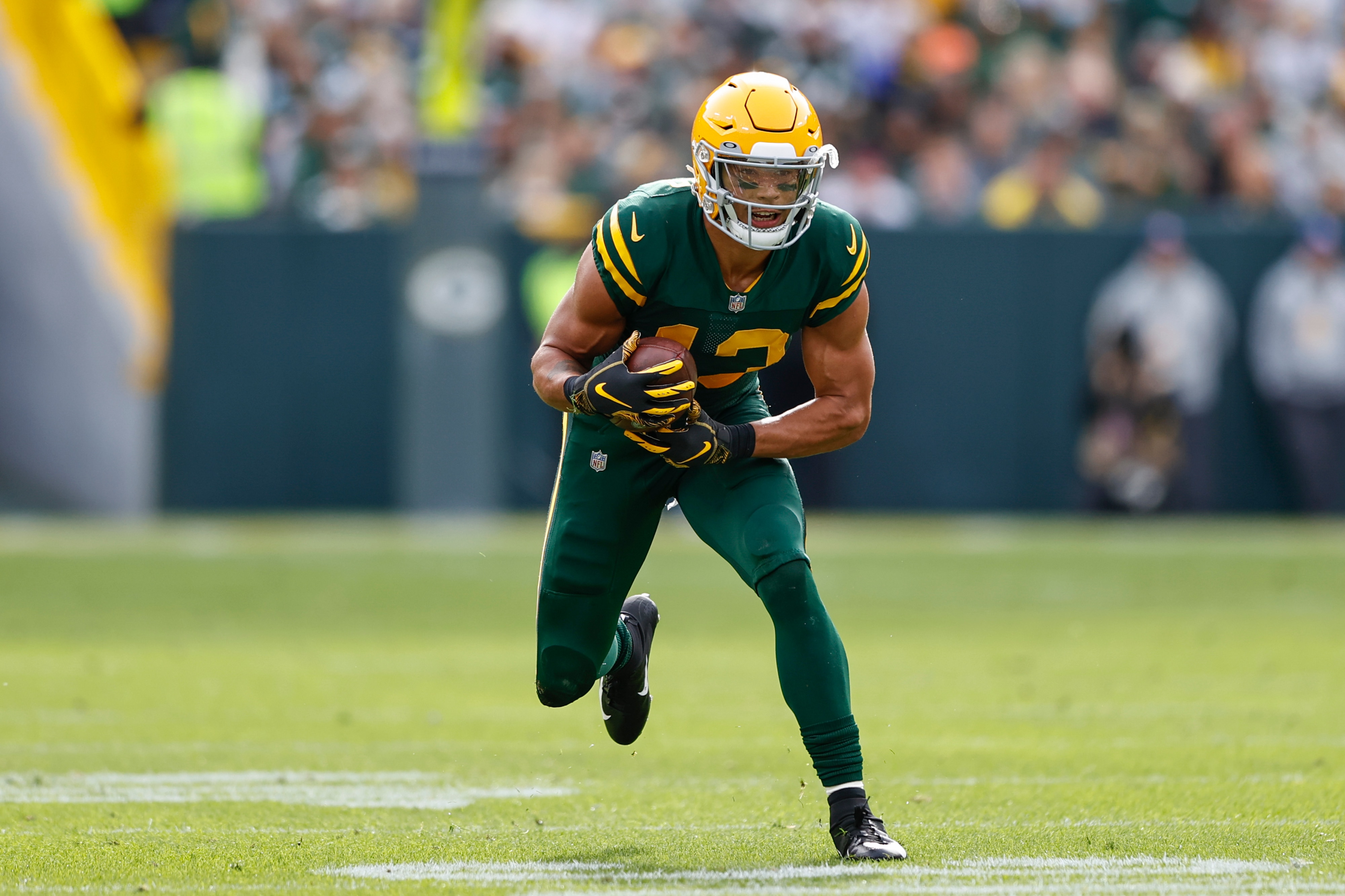 Green Bay Packers wide receiver Allen Lazard (13) rushes with the ball during the first half of an NFL football game against the Washington Football Team, Sunday, Oct. 24, 2021, in Green Bay, Wis. (AP Photo/Kamil Krzaczynski)