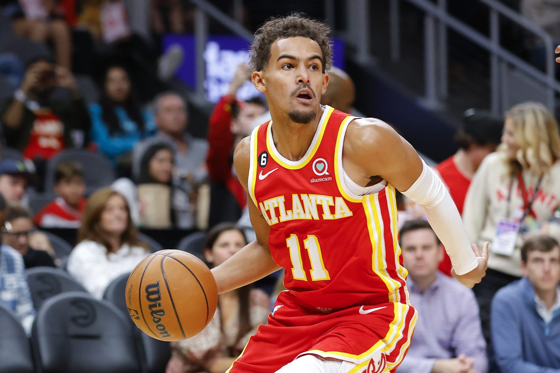 ATLANTA, GA - OCTOBER 23: Trae Young #11 of the Atlanta Hawks drives tot he basket during the first half against the Charlotte Hornets at State Farm Arena on October 23, 2022 in Atlanta, Georgia. NOTE TO USER: User expressly acknowledges and agrees that, by downloading and or using this photograph, User is consenting to the terms and conditions of the Getty Images License Agreement. (Photo by Todd Kirkland/Getty Images)