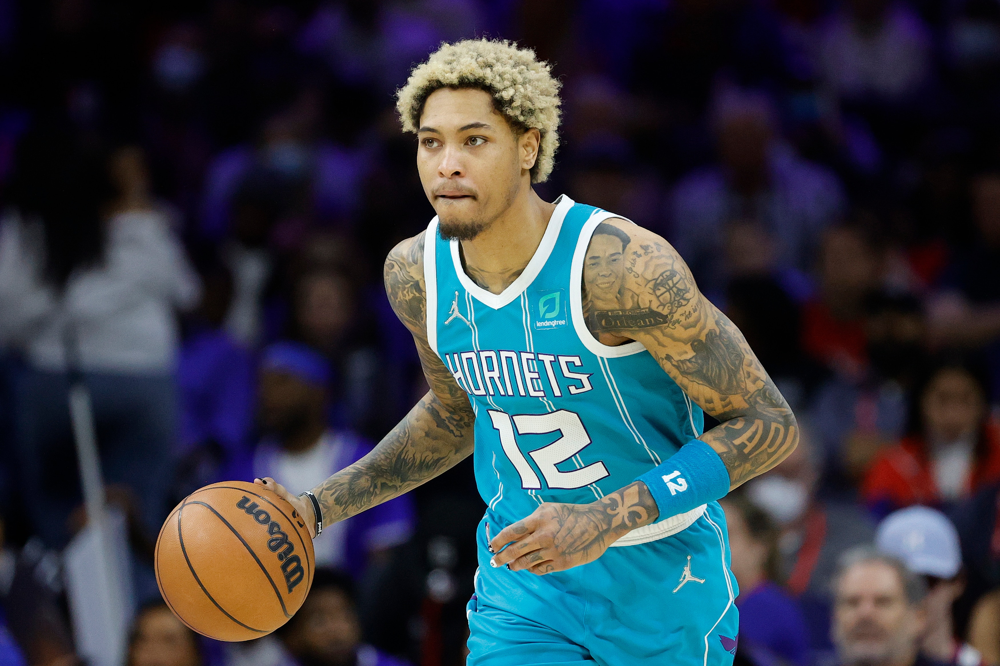 PHILADELPHIA, PENNSYLVANIA - APRIL 02: Kelly Oubre Jr. #12 of the Charlotte Hornets dribbles during the third quarter against the Philadelphia 76ers at Wells Fargo Center on April 02, 2022 in Philadelphia, Pennsylvania.  NOTE TO USER: User expressly acknowledges and agrees that, by downloading and or using this photograph, User is consenting to the terms and conditions of the Getty Images License Agreement. (Photo by Tim Nwachukwu/Getty Images)