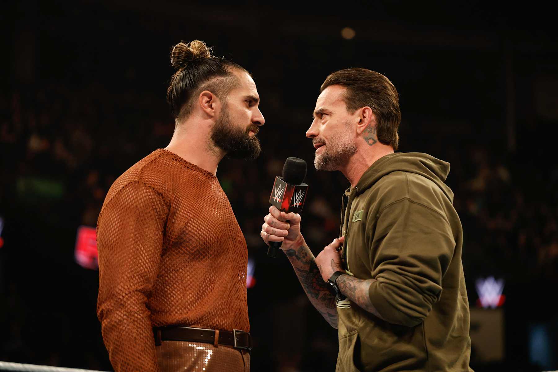 EVERETT, WASHINGTON - DECEMBER 2: Seth Rollins and CM Punk speak during Monday Night RAW at Angel of the Winds Arena on December 2, 2024 in Everett, Washington.  (Photo by WWE/Getty Images)