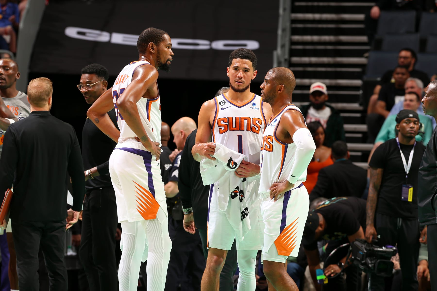 CHARLOTTE, NC - MARCH 1:  Kevin Durant #35 talks to Devin Booker #1 and Chris Paul #3 of the Phoenix Suns during the game against the Charlotte Hornets on March 1, 2023 at Spectrum Center in Charlotte, North Carolina. NOTE TO USER: User expressly acknowledges and agrees that, by downloading and or using this photograph, User is consenting to the terms and conditions of the Getty Images License Agreement. Mandatory Copyright Notice: Copyright 2023 NBAE (Photo by Kent Smith/NBAE via Getty Images)
