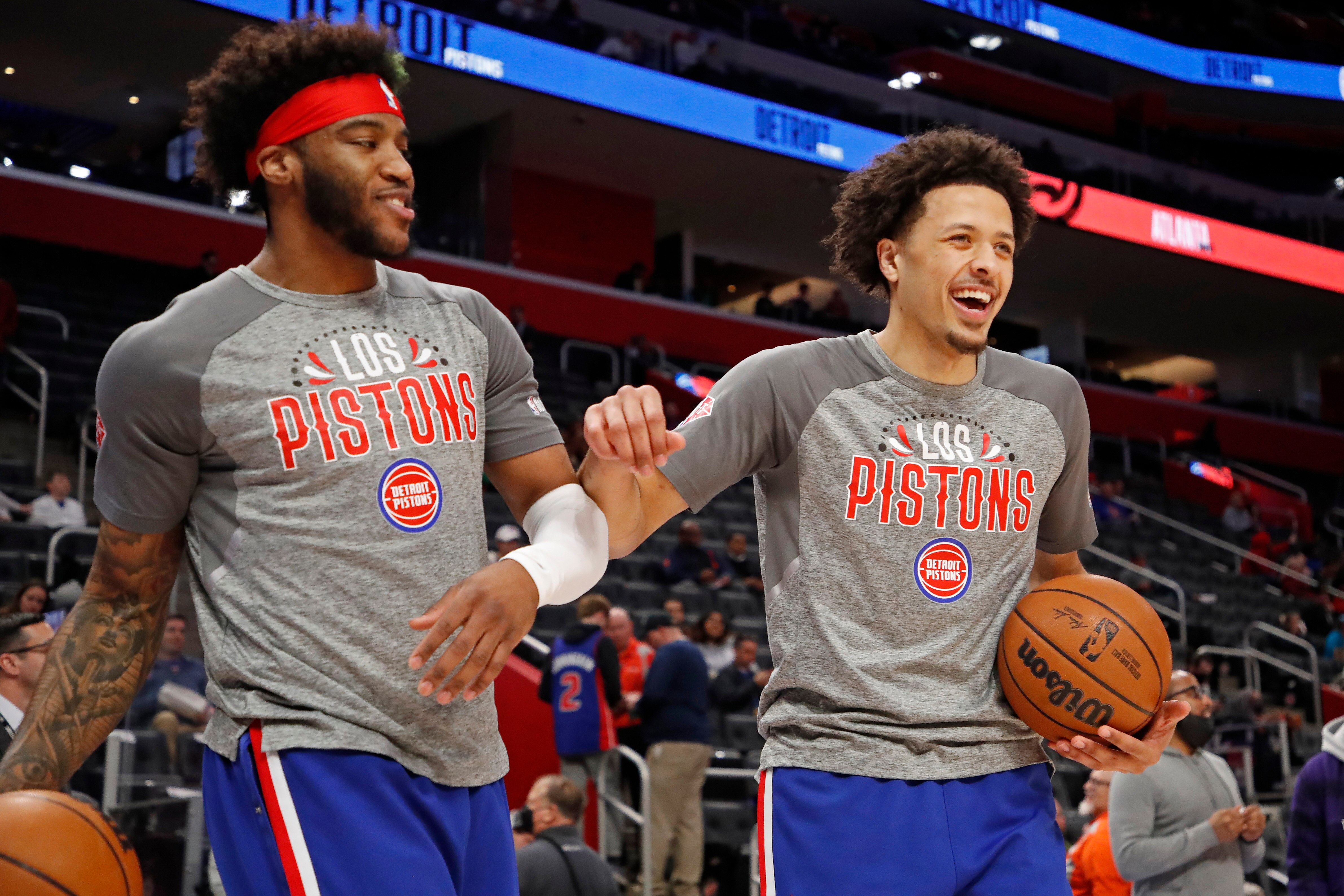 DETROIT, MI - MARCH 7: Saddiq Bey #41 and Cade Cunningham #2 of the Detroit Pistons laugh before the game against the Atlanta Hawks  on March 7, 2022 at Little Caesars Arena in Detroit, Michigan. NOTE TO USER: User expressly acknowledges and agrees that, by downloading and/or using this photograph, User is consenting to the terms and conditions of the Getty Images License Agreement. Mandatory Copyright Notice: Copyright 2022 NBAE (Photo by Brian Sevald/NBAE via Getty Images)