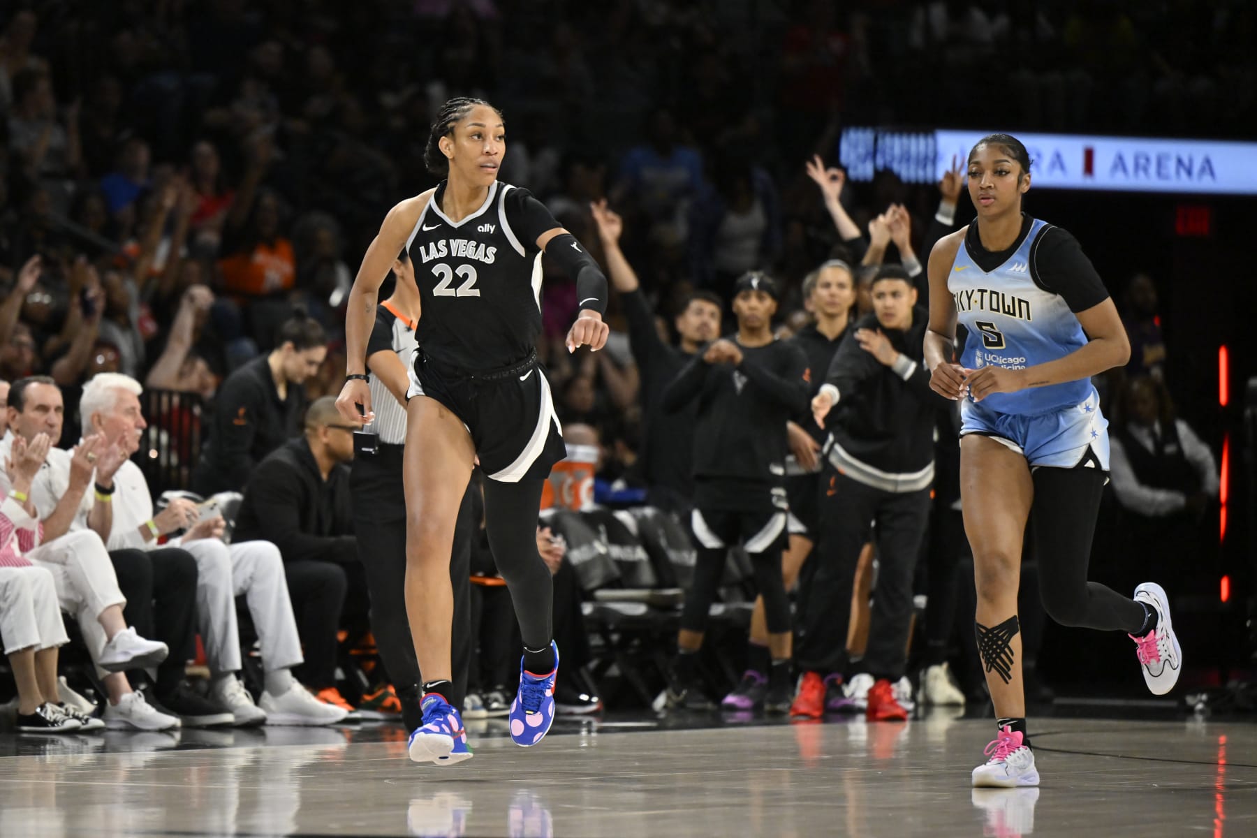LAS VEGAS, NV - JULY 16: A'ja Wilson #22 of the Las Vegas Aces and Angel Reese #5 of the Chicago Sky look on during the game on July 16, 2024 at Michelob ULTRA Arena in Las Vegas, Nevada. NOTE TO USER: User expressly acknowledges and agrees that, by downloading and or using this photograph, User is consenting to the terms and conditions of the Getty Images License Agreement. Mandatory Copyright Notice: Copyright 2024 NBAE (Photo by David Becker/NBAE via Getty Images)