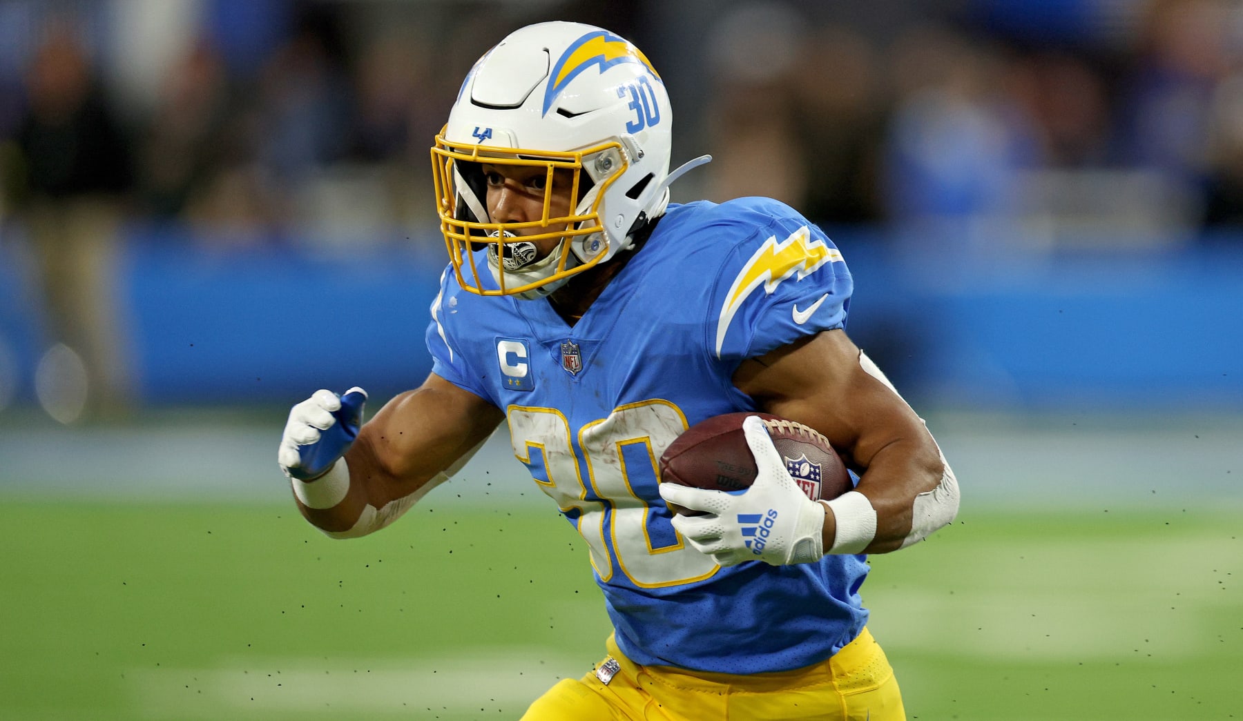 INGLEWOOD, CALIFORNIA - DECEMBER 11: Austin Ekeler #30 of the Los Angeles Chargers rushes in the first quarter during a game against the Miami Dolphins at SoFi Stadium on December 11, 2022 in Inglewood, California. (Photo by Harry How/Getty Images)