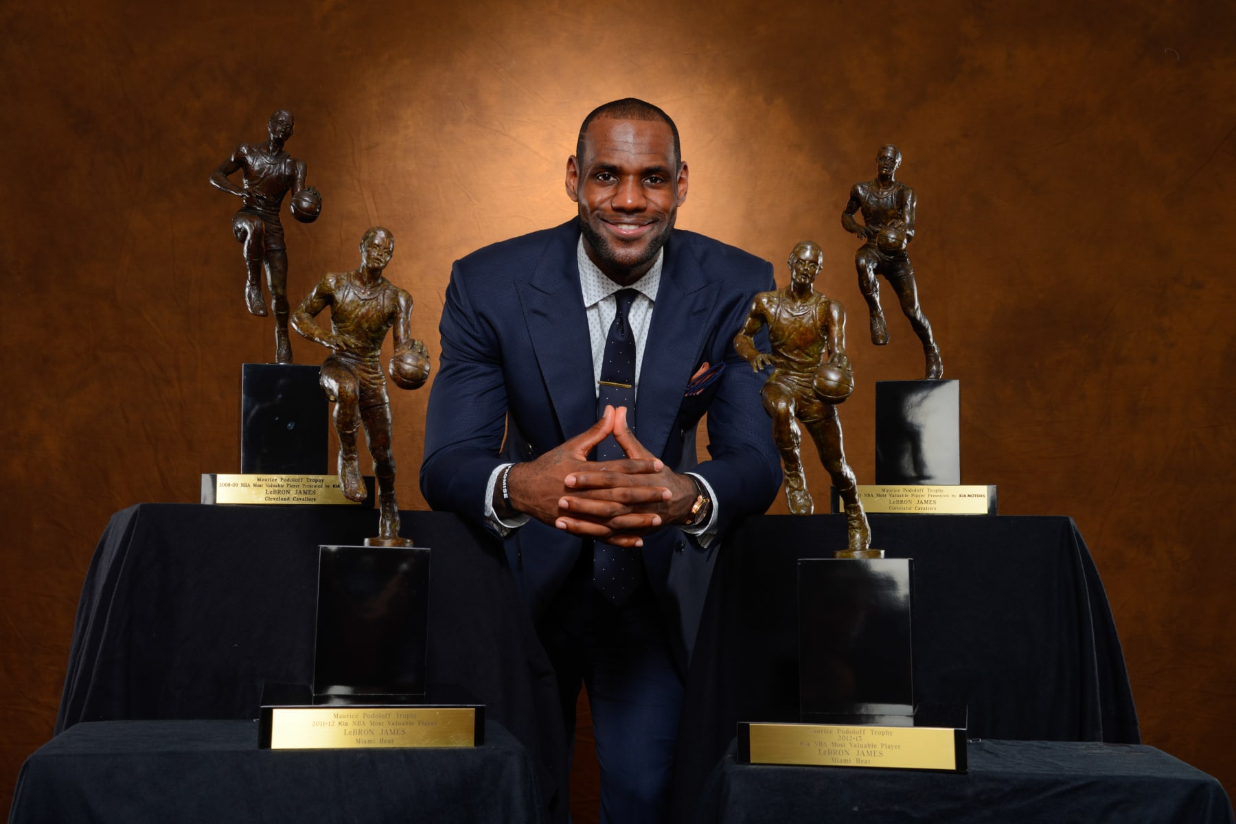 MIAMI, FL - MAY 5: LeBron James #6 of the Miami Heat poses with his collection of Maurice Podoloff Trophies after being named the 2012-2013 Kia NBA Most Valuable Player (MVP) of the Year for the fourth time on May 5, 2013 at American Airlines Arena in Miami, Florida. NOTE TO USER: User expressly acknowledges and agrees that, by downloading and or using this photograph, User is consenting to the terms and conditions of the Getty Images License Agreement. Mandatory Copyright Notice: Copyright 2013 NBAE (Photo by Jesse D. Garrabrant/NBAE via Getty Images)