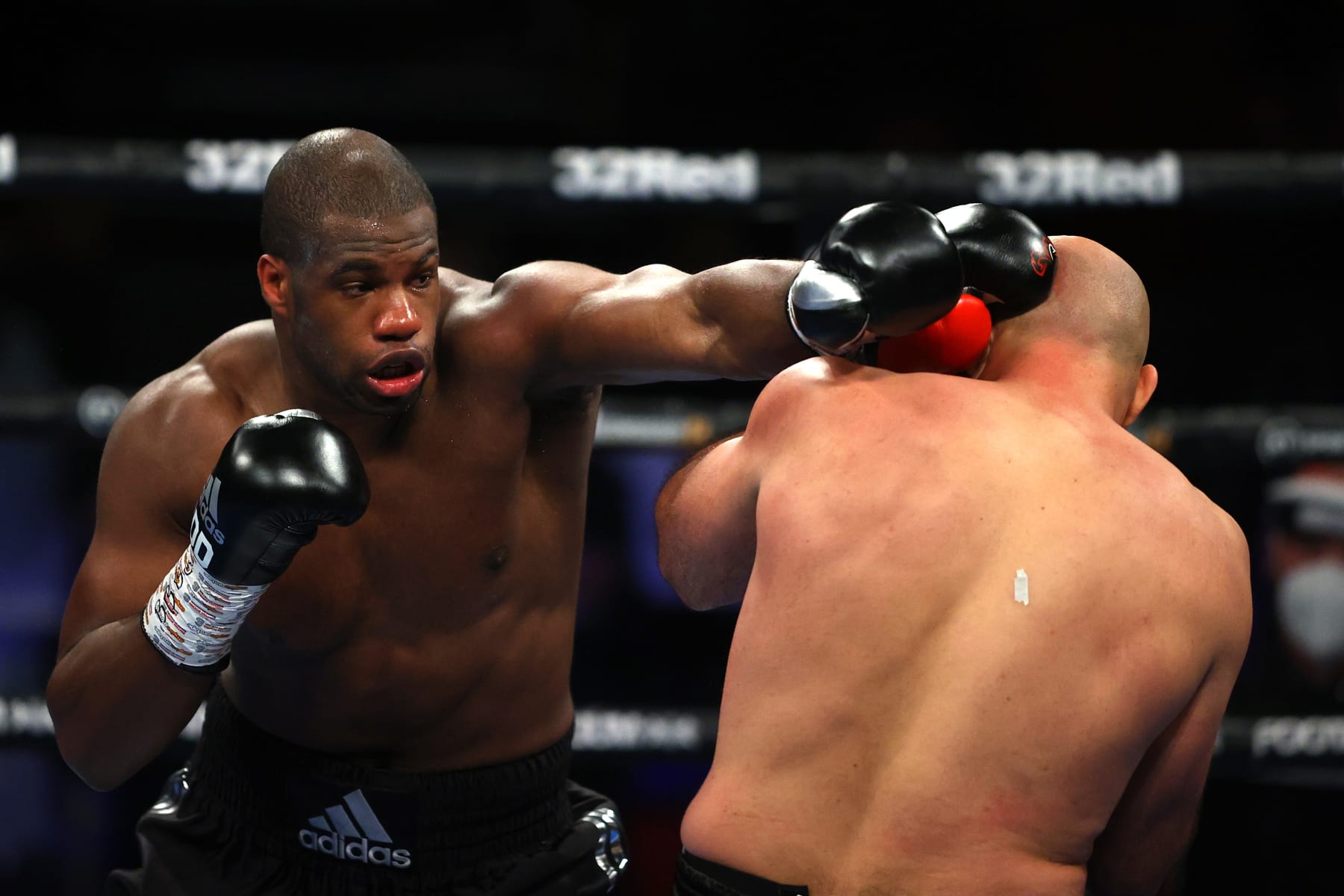 TELFORD, ENGLAND - JUNE 05: Daniel Dubois (L) punches Bogdan Dinu during the World Boxing Association Interim World Heavy Title fight between Daniel Dubois and Bogdan Dinu at Telford International Centre on June 05, 2021 in Telford, England. (Photo by Richard Heathcote/Getty Images)
