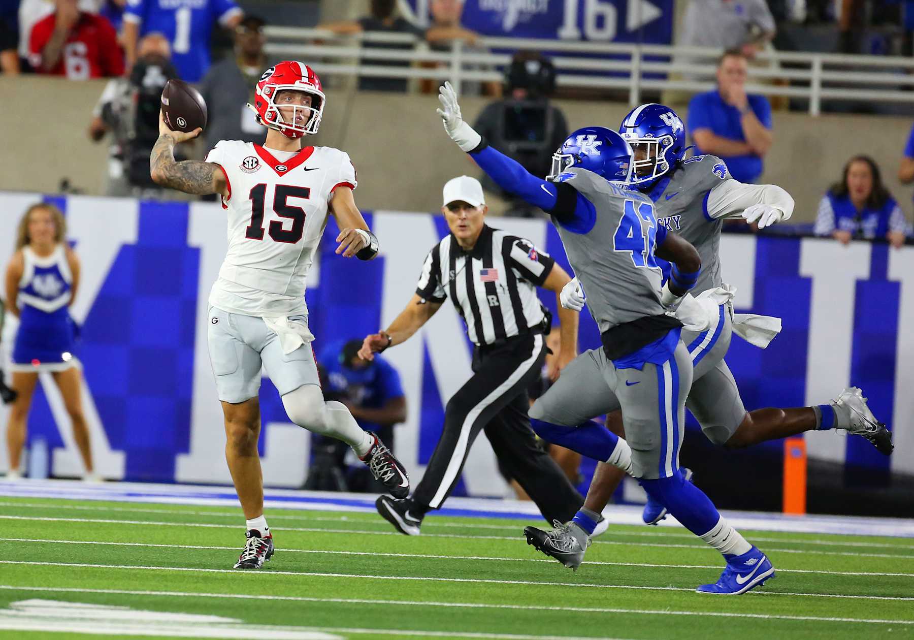 LEXINGTON, KY - SEPTEMBER 14: Georgia Bulldogs quarterback Carson Beck (15) is pursued by Kentucky Wildcats linebacker Tyreese Fearbry (42) and linebacker J.J. Weaver (13) in a game between the Kentucky Wildcats and the Georgia Bulldogs on September 14, 2024, at Kroger Field in Lexington, KY. (Photo by Jeff Moreland/Icon Sportswire via Getty Images)