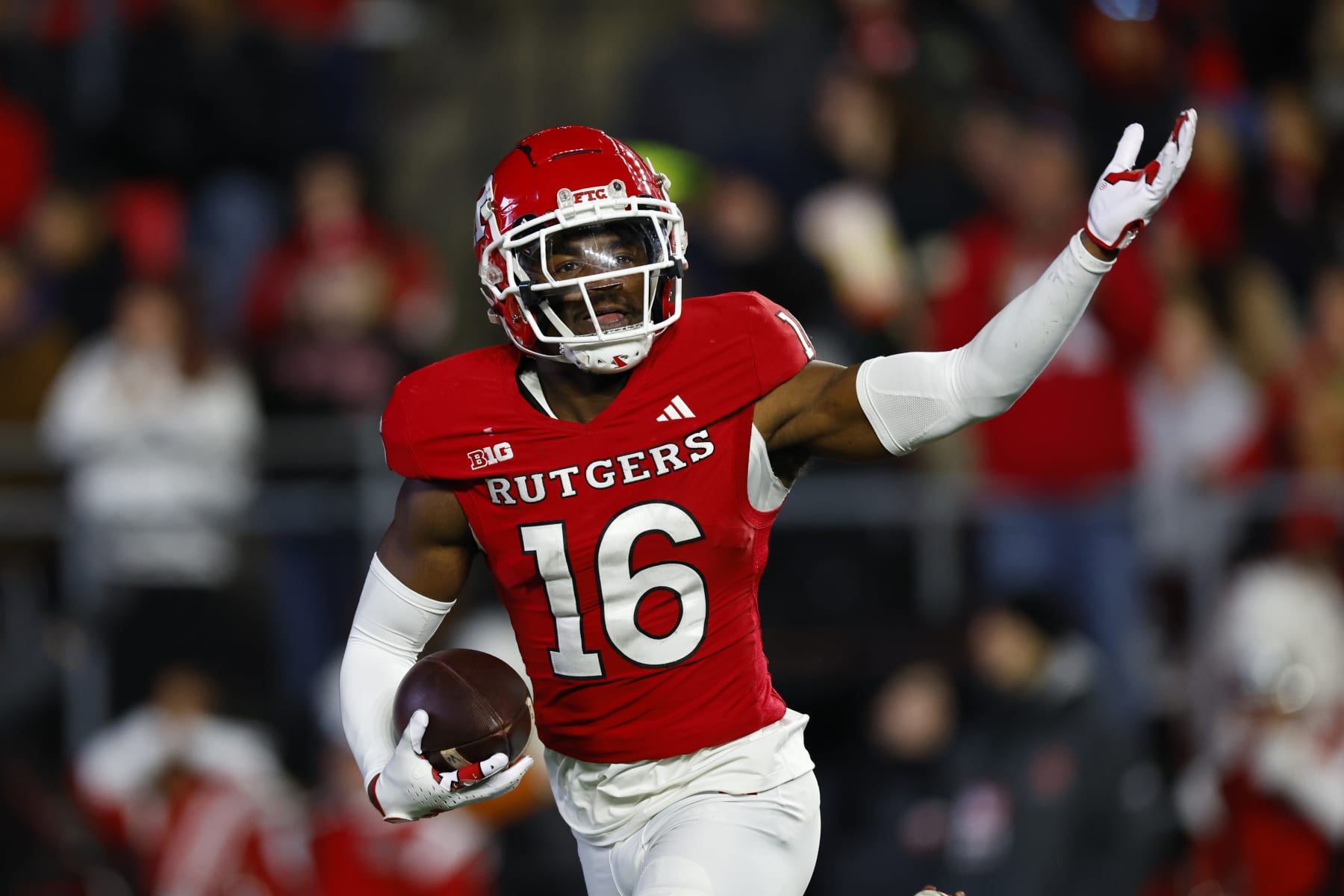 PISCATAWAY, NEW JERSEY - NOVEMBER 25: Defensive back Max Melton #16 of the Rutgers Scarlet Knights celebrates his interception against the Maryland Terrapins during the second quarter of a game at SHI Stadium on November 25, 2023 in Piscataway, New Jersey. (Photo by Rich Schultz/Getty Images)