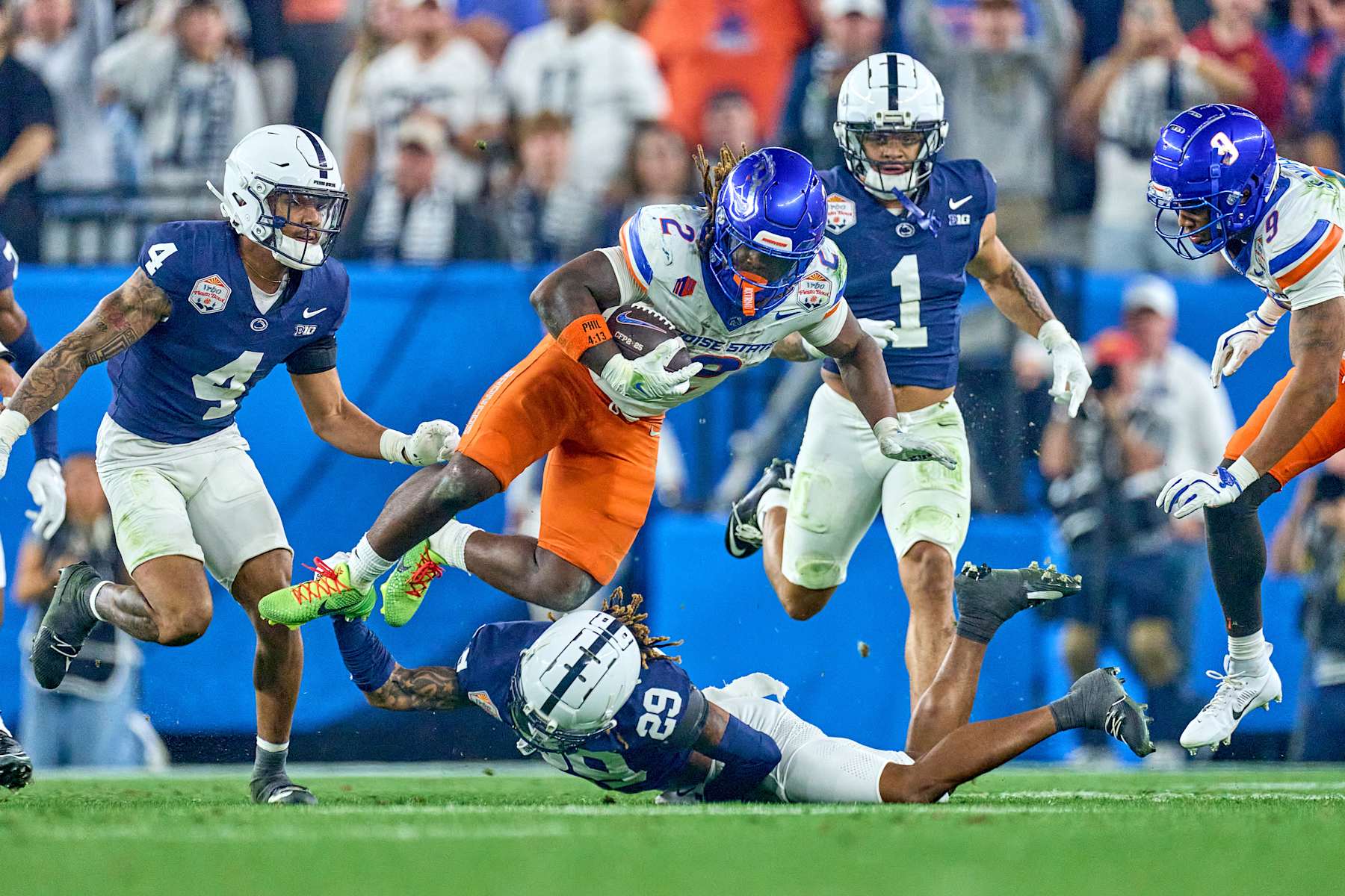 GLENDALE, ARIZONA - DECEMBER 31: Boise State Broncos running back Ashton Jeanty (2) battles with Penn State Nittany Lions cornerback Audavion Collins (29) in action during the 2024 Vrbo Fiesta Bowl between the Penn State Nittany Lions and Boise State Broncos at State Farm Stadium on December 31, 2024 in Glendale, Arizona. (Photo by Robin Alam/ISI Photos/Getty Images)