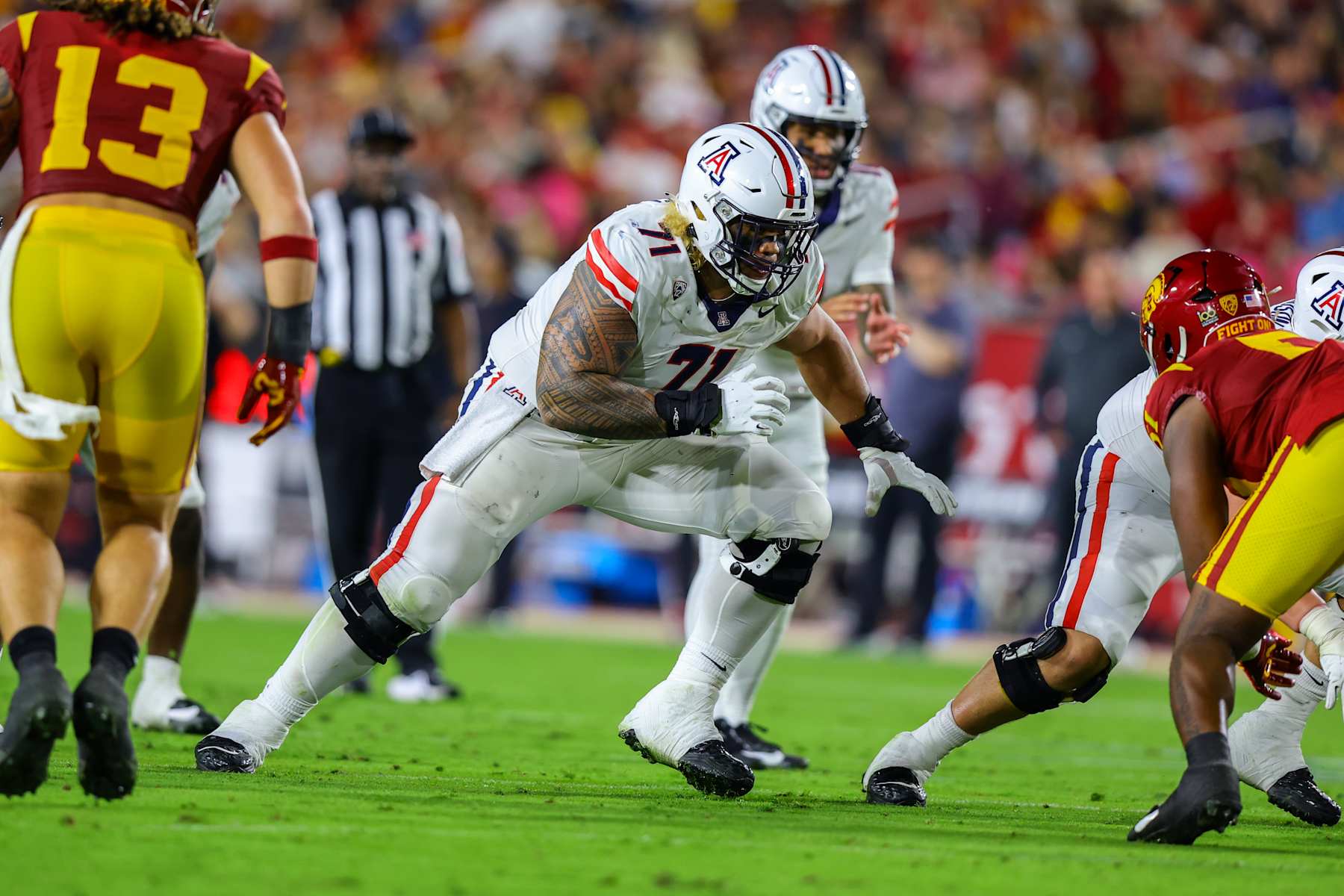 LOS ANGELES, CA - OCTOBER 07: Arizona Wildcats offensive lineman Jonah Savaiinaea (71) looks to block his opponent during a college football game between the Arizona Wildcats against the USC Trojans on October 07, 2023, at United Airlines Field at The Los Angeles Memorial Coliseum in Los Angeles, CA.(Photo by Jordon Kelly/Icon Sportswire via Getty Images)