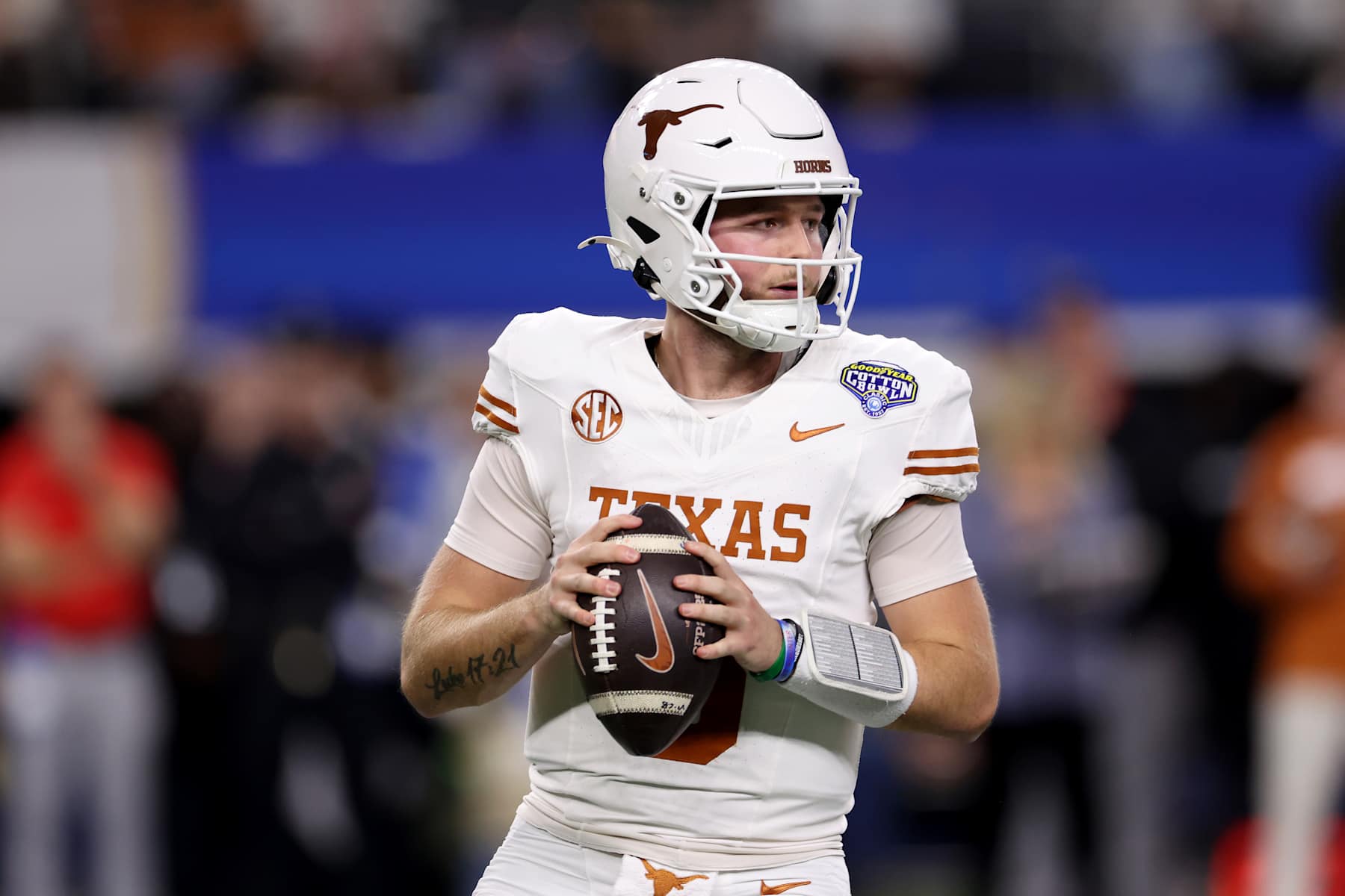 ARLINGTON, TEXAS - JANUARY 10: Quinn Ewers #3 of the Texas Longhorns drops back to pass in the first quarter against the Ohio State Buckeyes during the Goodyear Cotton Bowl at AT&T Stadium on January 10, 2025 in Arlington, Texas. (Photo by Sam Hodde/Getty Images)