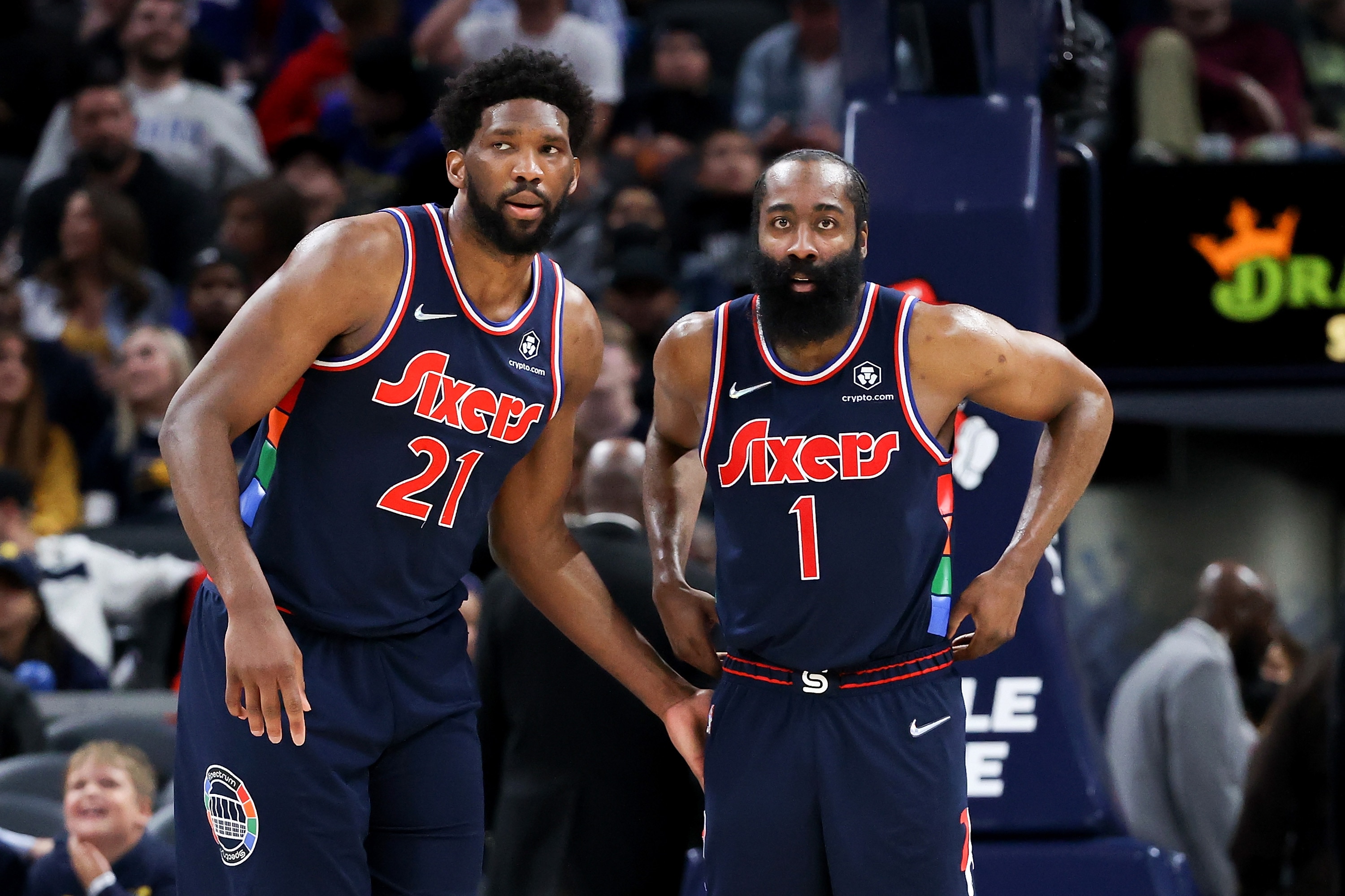 INDIANAPOLIS, INDIANA - APRIL 05: Joel Embiid #21 and James Harden #1 of the Philadelphia 76ers meet in the fourth quarter against the Indiana Pacers at Gainbridge Fieldhouse on April 05, 2022 in Indianapolis, Indiana. NOTE TO USER: User expressly acknowledges and agrees that, by downloading and or using this Photograph, user is consenting to the terms and conditions of the Getty Images License Agreement. (Photo by Dylan Buell/Getty Images)