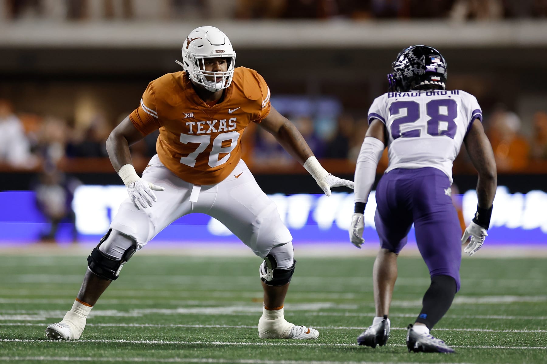 AUSTIN, TEXAS - NOVEMBER 12: Kelvin Banks Jr. #78 of the Texas Longhorns blocks Millard Bradford #28 of the TCU Horned Frogs in the first half at Darrell K Royal-Texas Memorial Stadium on November 12, 2022 in Austin, Texas. (Photo by Tim Warner/Getty Images)