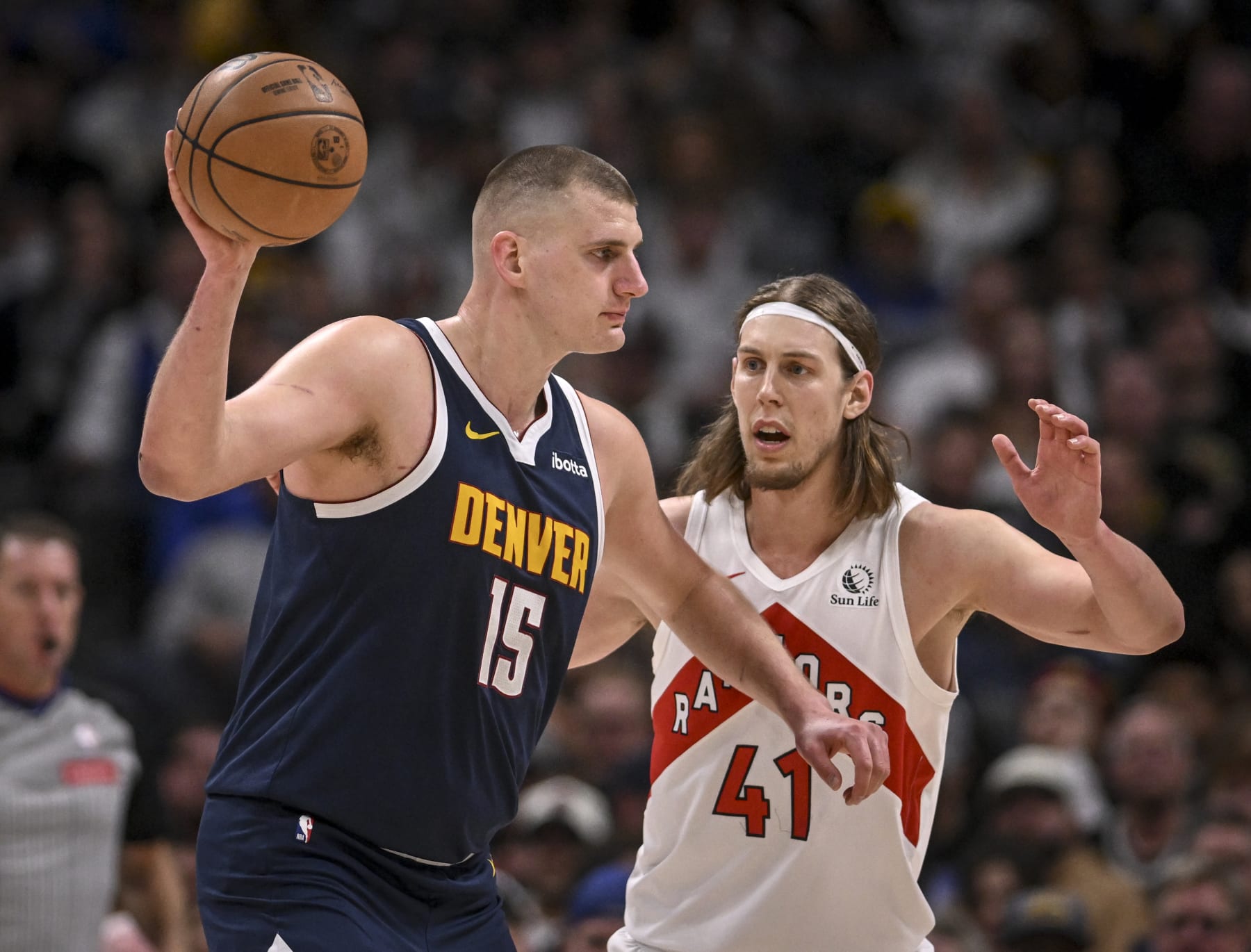 DENVER, CO - MARCH 11: Nikola Jokic (15) of the Denver Nuggets works against Kelly Olynyk (41) of the Toronto Raptors during the second quarter at Ball Arena in Denver on Monday, March 11, 2024. (Photo by AAron Ontiveroz/The Denver Post)