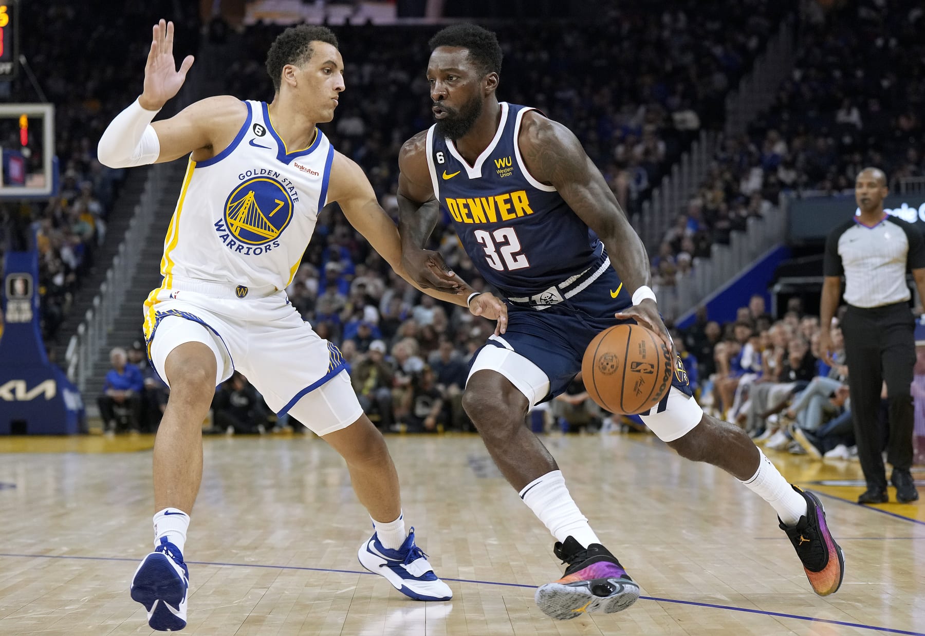 SAN FRANCISCO, CALIFORNIA - OCTOBER 14: Jeff Green #32 of the Denver Nuggets drives to the basket on Patrick Baldwin Jr. #7 of the Golden State Warriors during the first half of an NBA basketball game at Chase Center on October 14, 2022 in San Francisco, California. NOTE TO USER: User expressly acknowledges and agrees that, by downloading and or using this photograph, User is consenting to the terms and conditions of the Getty Images License Agreement. (Photo by Thearon W. Henderson/Getty Images)