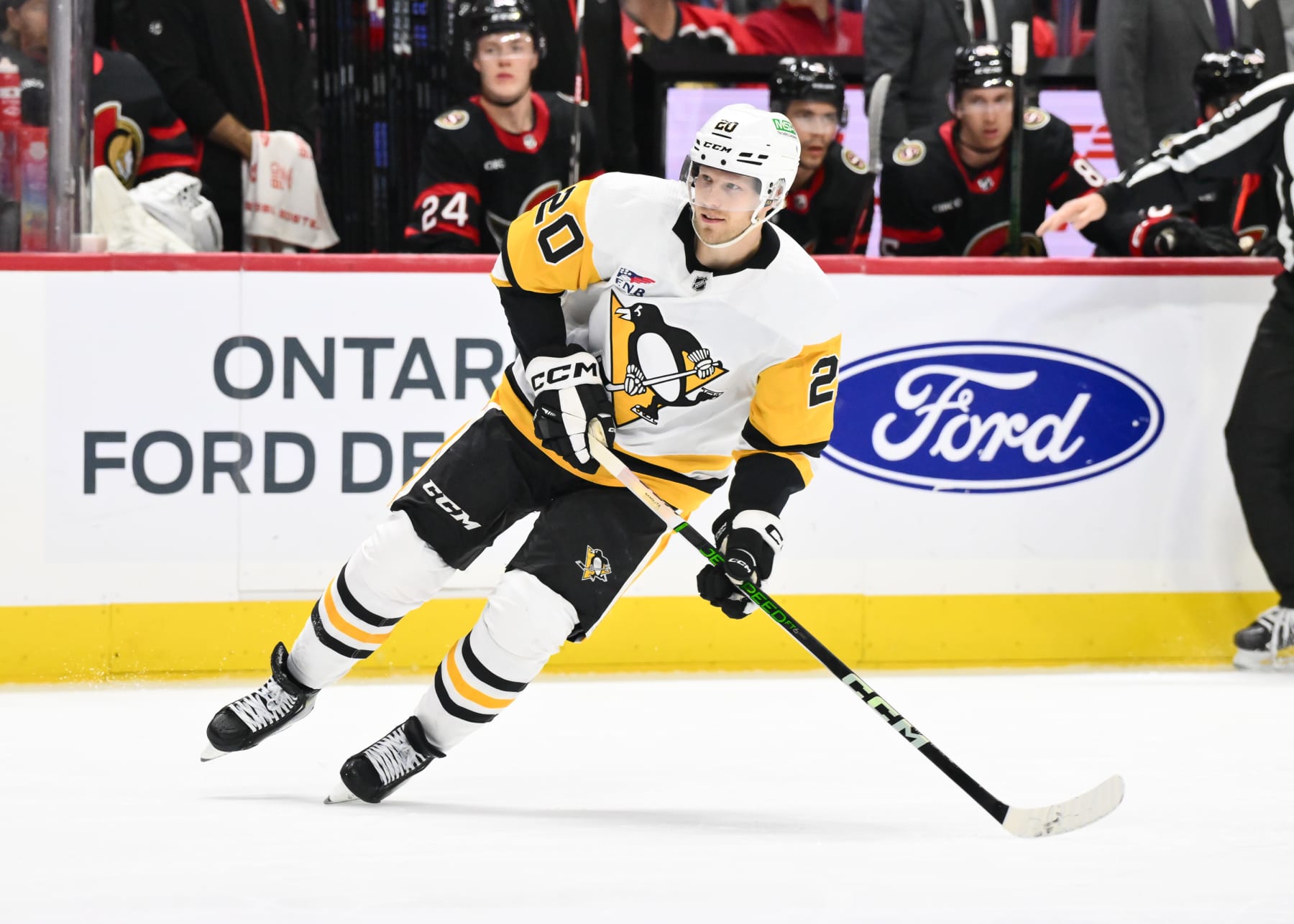 OTTAWA, CANADA - DECEMBER 23:  Lars Eller #20 of the Pittsburgh Penguins skates during the third period against the Ottawa Senators at Canadian Tire Centre on December 23, 2023 in Ottawa, Ontario, Canada.  The Ottawa Senators defeated the Pittsburgh Penguins 5-4 in overtime.  (Photo by Minas Panagiotakis/Getty Images)