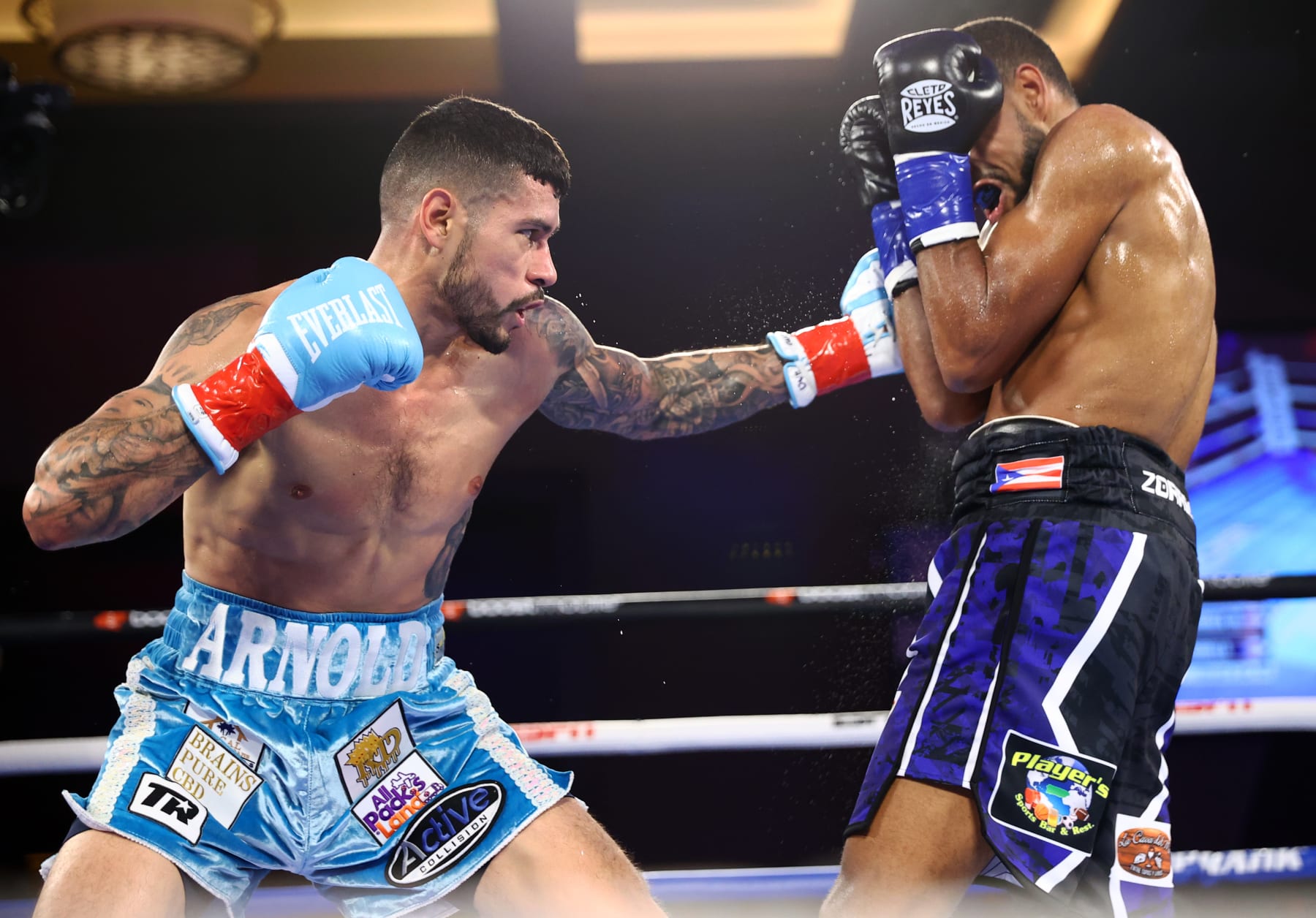 TEMECULA, CALIFORNIA - JULY 15: Arnold Barboza Jr (L) and Danielito Zorrilla (R) exchange punches during their WBO Intercontinental jr. welterweight championship fight on July 15, 2022 in Temecula, California. (Photo by Mikey Williams/Top Rank Inc via Getty Images)