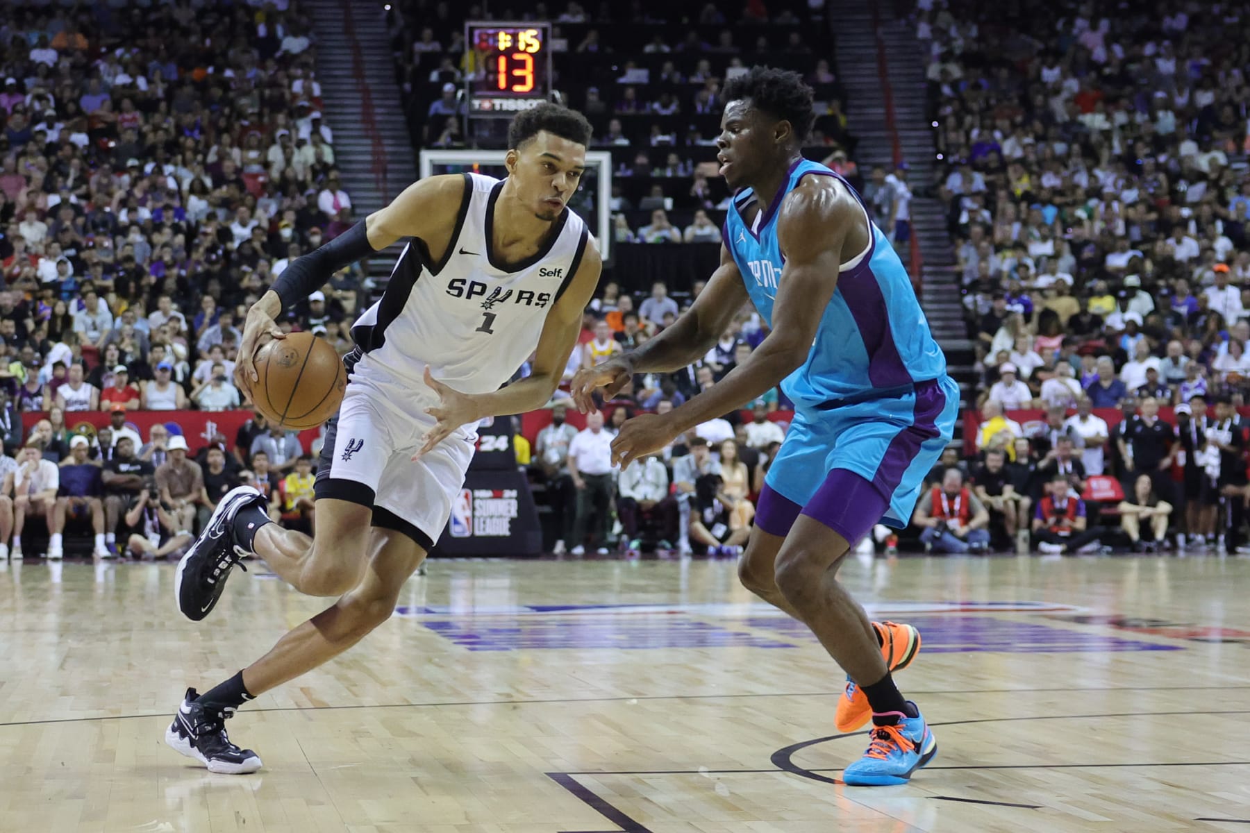 LAS VEGAS, NEVADA - JULY 07: Victor Wembanyama #1 of the San Antonio Spurs drives to the basket against James Nnaji #46 of the Charlotte Hornets during the first quarter at the Thomas & Mack Center on July 07, 2023 in Las Vegas, Nevada. (Photo by Ethan Miller/Getty Images)