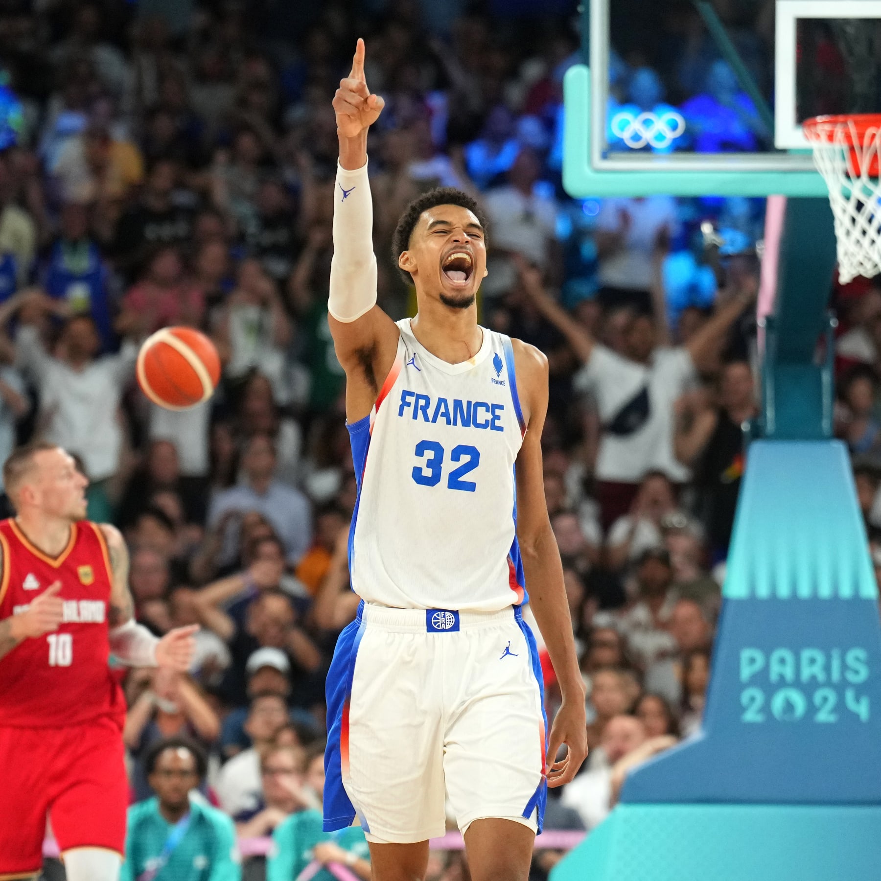 LILLE, FRANCE - AUGUST 8: Victor Wembanyama #32 of Team France celebrates during the game against Team Germany during the Men's Semi-Finals on August 8, 2024 at the Stade Pierre Mauroy in Paris, France. NOTE TO USER: User expressly acknowledges and agrees that, by downloading and/or using this photograph, user is consenting to the terms and conditions of the Getty Images License Agreement. Mandatory Copyright Notice: Copyright 2024 NBAE (Photo by Jesse D. Garrabrant/NBAE via Getty Images)