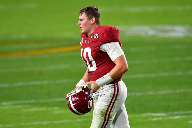 MIAMI GARDENS, FLORIDA - JANUARY 11: Mac Jones #10 of the Alabama Crimson Tide runs off the field during the College Football Playoff National Championship football game against the Ohio State Buckeyes at Hard Rock Stadium on January 11, 2021 in Miami Gardens, Florida. The Alabama Crimson Tide defeated the Ohio State Buckeyes 52-24. (Photo by Alika Jenner/Getty Images)