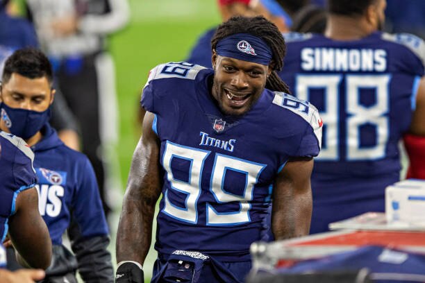 NASHVILLE, TN - NOVEMBER 12:  Jadeveon Clowney #99 of the Tennessee Titans talks with teammates during a game against the Indianapolis Colts at Nissan Stadium on November 12, 2020 in Nashville, Tennessee.  The Colts defeated the Titans 34-17.  (Photo by Wesley Hitt/Getty Images)
