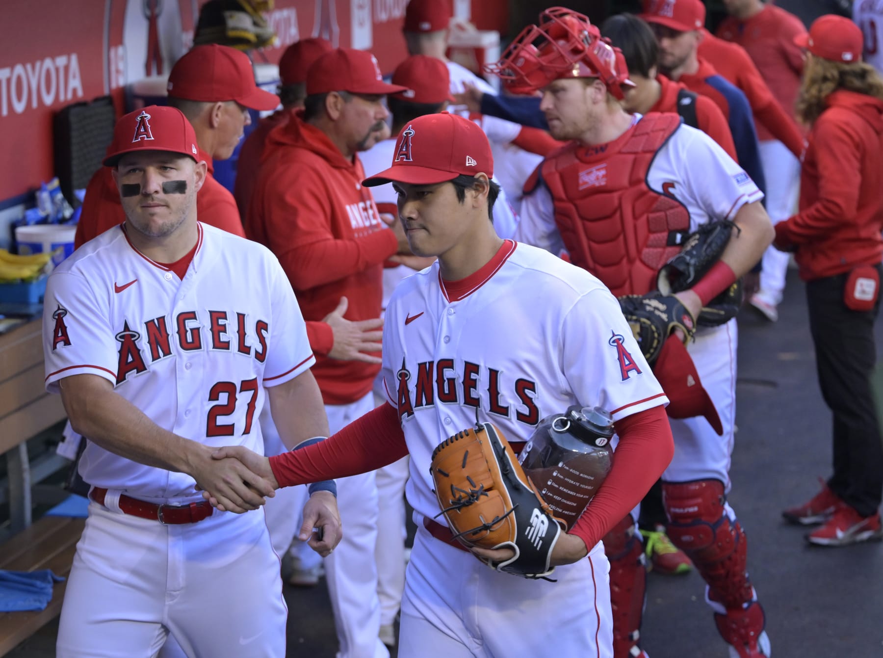 ANAHEIM, CALIFORNIA - MAY 27: Mike Trout #27 and Shohei Ohtani #17 of the Los Angeles Angels talk in the dugout prior to the game against the Miami Marlins at Angel Stadium of Anaheim on May 27, 2023 in Anaheim, California. (Photo by Jayne Kamin-Oncea/Getty Images)