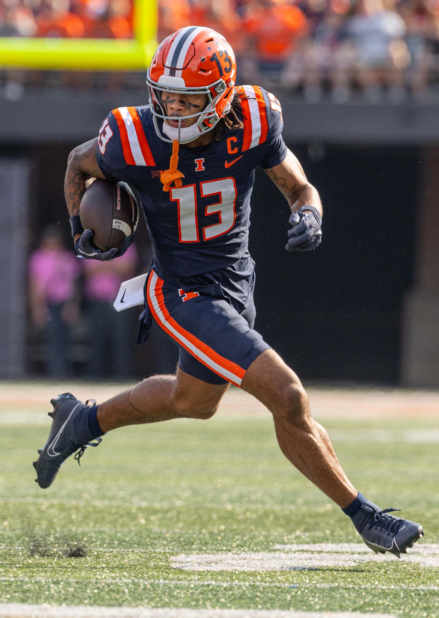 CHAMPAIGN, ILLINOIS - OCTOBER 12: Pat Bryant #13 of the Illinois Fighting Illini runs the ball against the Purdue Boilermakers at Memorial Stadium on October 12, 2024 in Champaign, Illinois.  (Photo by Michael Hickey/Getty Images)