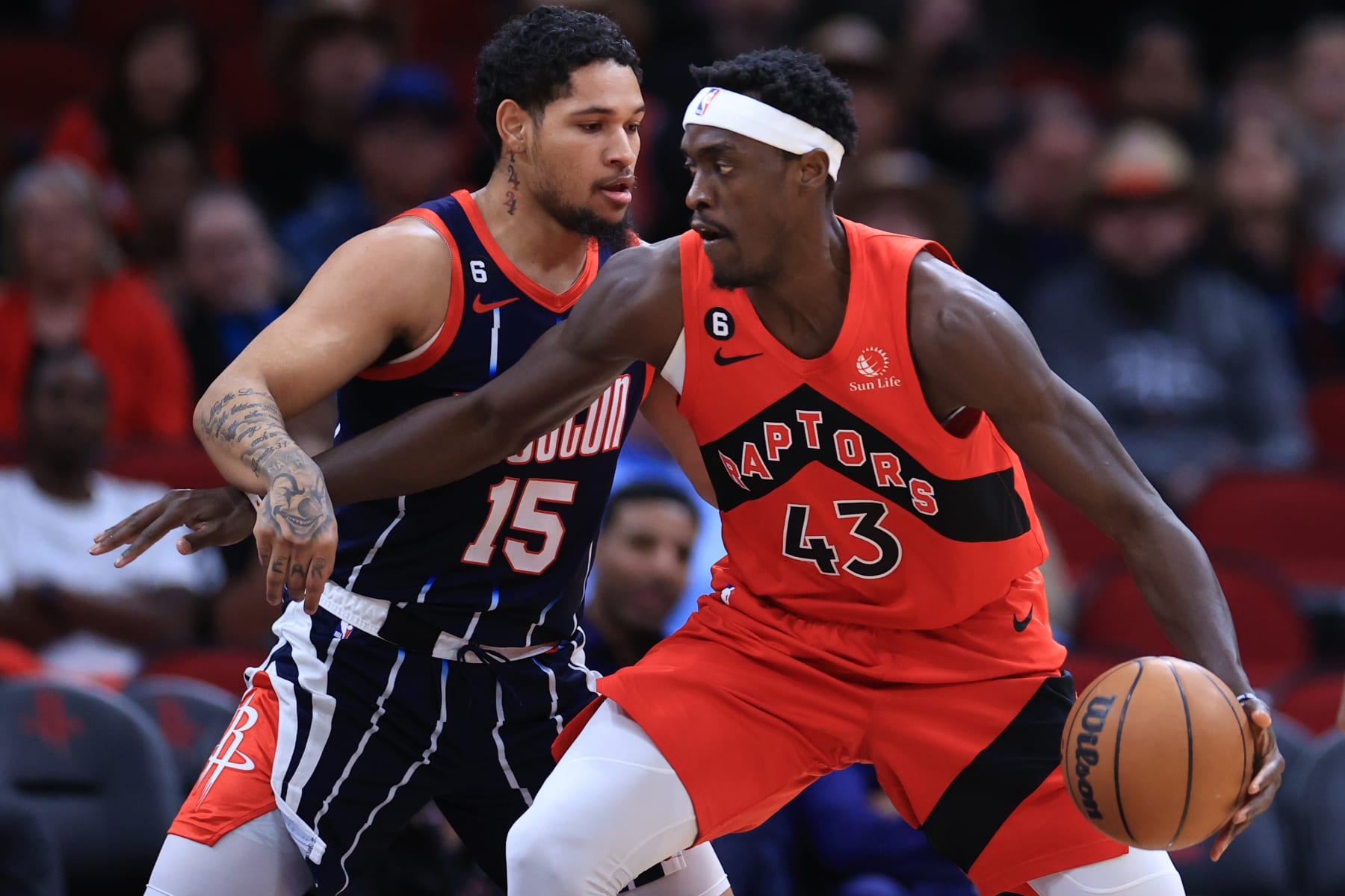 HOUSTON, TEXAS - FEBRUARY 03: Pascal Siakam #43 of the Toronto Raptors controls the ball ahead of Daishen Nix #15 of the Houston Rockets during the first half at Toyota Center on February 03, 2023 in Houston, Texas. NOTE TO USER: User expressly acknowledges and agrees that, by downloading and or using this photograph, User is consenting to the terms and conditions of the Getty Images License Agreement. (Photo by Carmen Mandato/Getty Images)