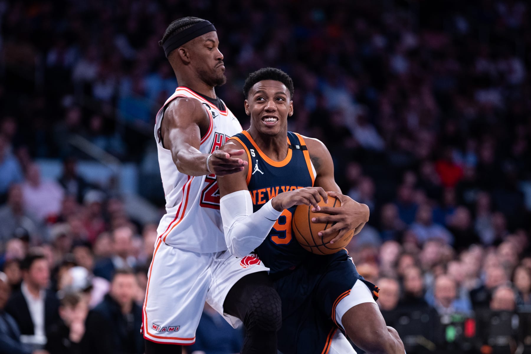 NEW YORK, NEW YORK - MARCH 29: RJ Barrett #9 of the New York Knicks is guarded by Jimmy Butler #22 of the Miami Heat during the fourth quarter of the game at Madison Square Garden on March 29, 2023 in New York City. NOTE TO USER: User expressly acknowledges and agrees that, by downloading and or using this photograph, User is consenting to the terms and conditions of the Getty Images License Agreement. (Photo by Dustin Satloff/Getty Images)