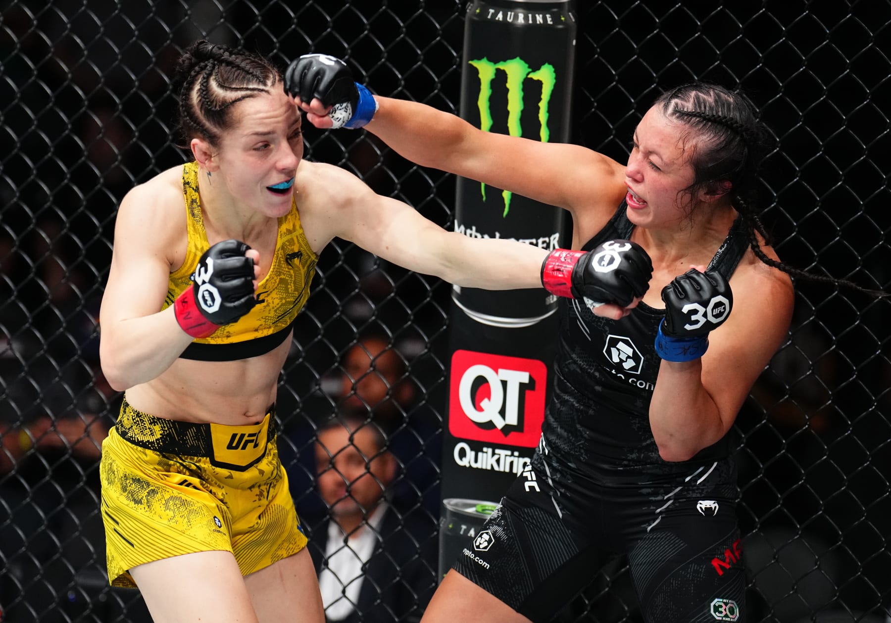 LAS VEGAS, NEVADA - SEPTEMBER 16: (L-R) Josefine Knutsson of Sweden and Marnic Mann trade punches in a strawweight fight during the Noche UFC event at T-Mobile Arena on September 16, 2023 in Las Vegas, Nevada. (Photo by Chris Unger/Zuffa LLC via Getty Images)