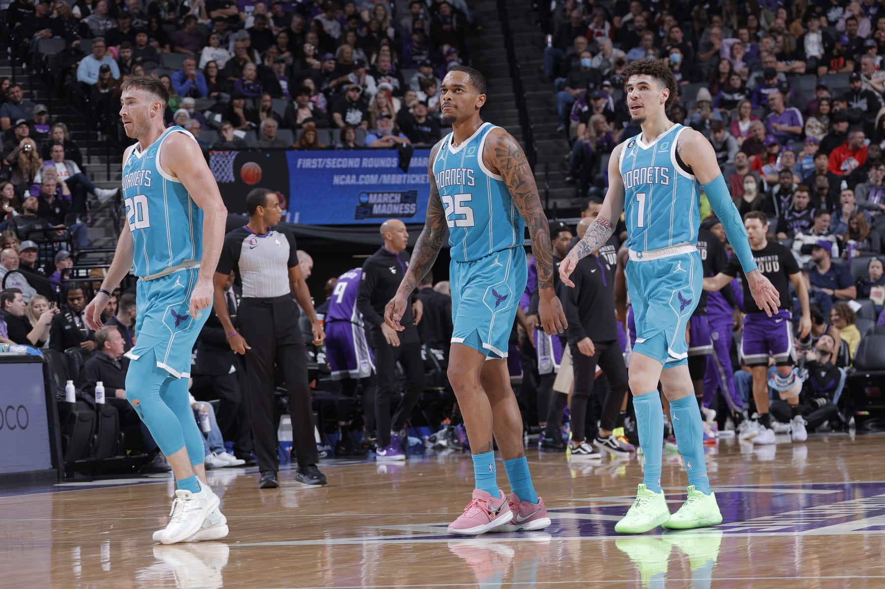SACRAMENTO, CA - DECEMBER 19: Gordon Hayward #20, P.J. Washington #25, and LaMelo Ball #1 of the Charlotte Hornets walk to the bench during a timeout during the game against the Sacramento Kings on December 19, 2022 at Golden 1 Center in Sacramento, California. NOTE TO USER: User expressly acknowledges and agrees that, by downloading and or using this photograph, User is consenting to the terms and conditions of the Getty Images Agreement. Mandatory Copyright Notice: Copyright 2022 NBAE (Photo by Rocky Widner/NBAE via Getty Images)