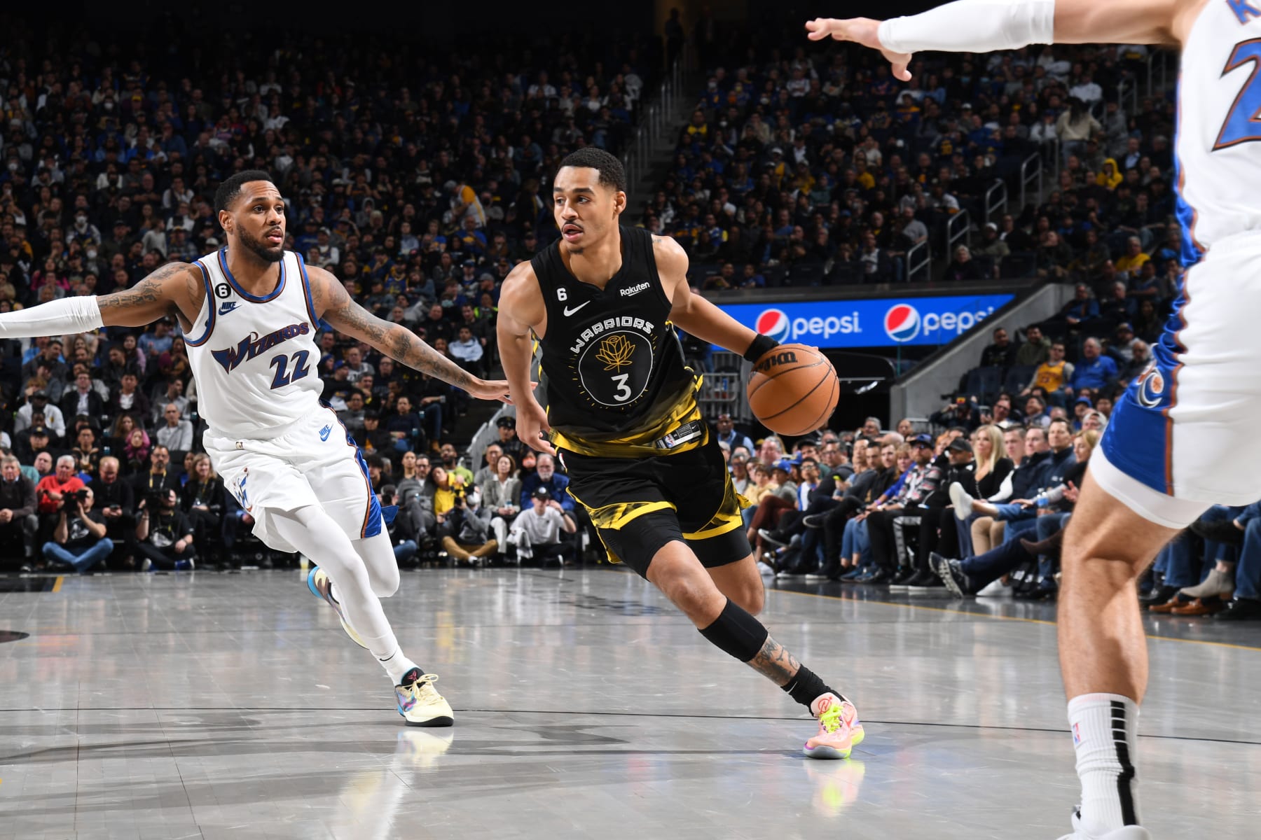 SAN FRANCISCO, CA - FEBRUARY 13: Jordan Poole #3 of the Golden State Warriors dribbles the ball during the game against the Washington Wizards on February 13, 2023 at Chase Center in San Francisco, California. NOTE TO USER: User expressly acknowledges and agrees that, by downloading and or using this photograph, user is consenting to the terms and conditions of Getty Images License Agreement. Mandatory Copyright Notice: Copyright 2023 NBAE (Photo by Noah Graham/NBAE via Getty Images)
