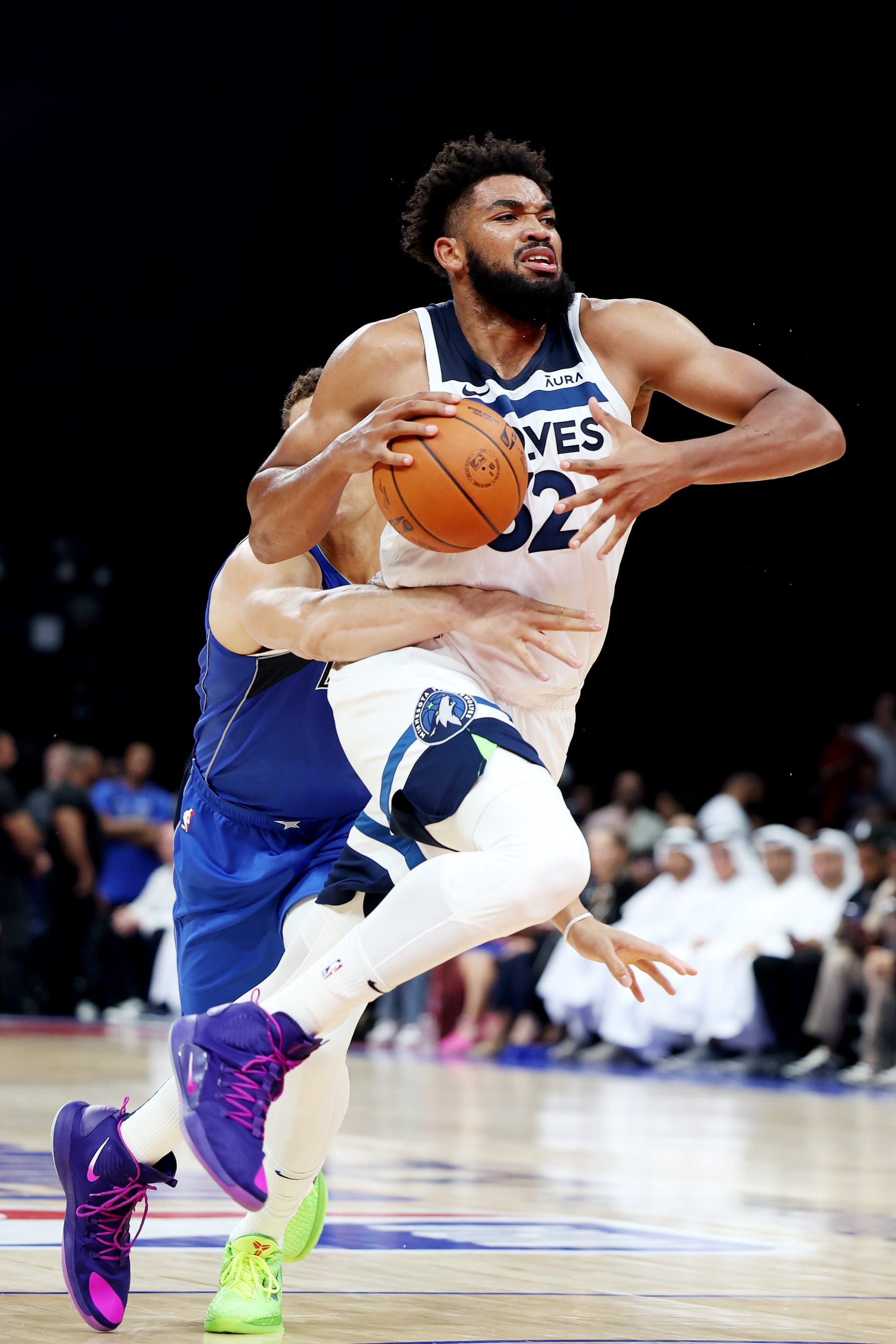 ABU DHABI, UNITED ARAB EMIRATES - OCTOBER 07: Karl-Anthony Towns #32 of the Minnesota Timberwolves controls the ball during the first half of the preseason NBA game between Minnesota Timberwolves and Dallas Mavericks at Etihad Arena on October 07, 2023 in Abu Dhabi, United Arab Emirates. NOTE TO USER: User expressly acknowledges and agrees that, by downloading and or using this photograph, User is consenting to the terms and conditions of the Getty Images License Agreement. (Photo by Christopher Pike/Getty Images)