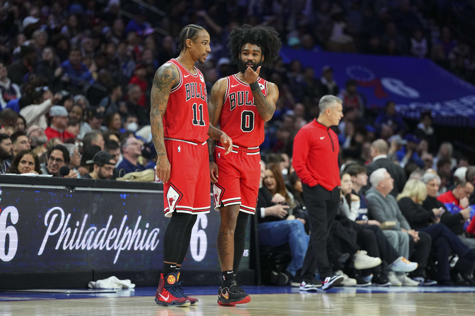 PHILADELPHIA, PENNSYLVANIA - JANUARY 2: DeMar DeRozan #11 of the Chicago Bulls talks to Coby White #0 against the Philadelphia 76ers at the Wells Fargo Center on January 2, 2024 in Philadelphia, Pennsylvania. The 76ers defeated the Bulls 110-97. NOTE TO USER: User expressly acknowledges and agrees that, by downloading and or using this photograph, User is consenting to the terms and conditions of the Getty Images License Agreement. (Photo by Mitchell Leff/Getty Images)