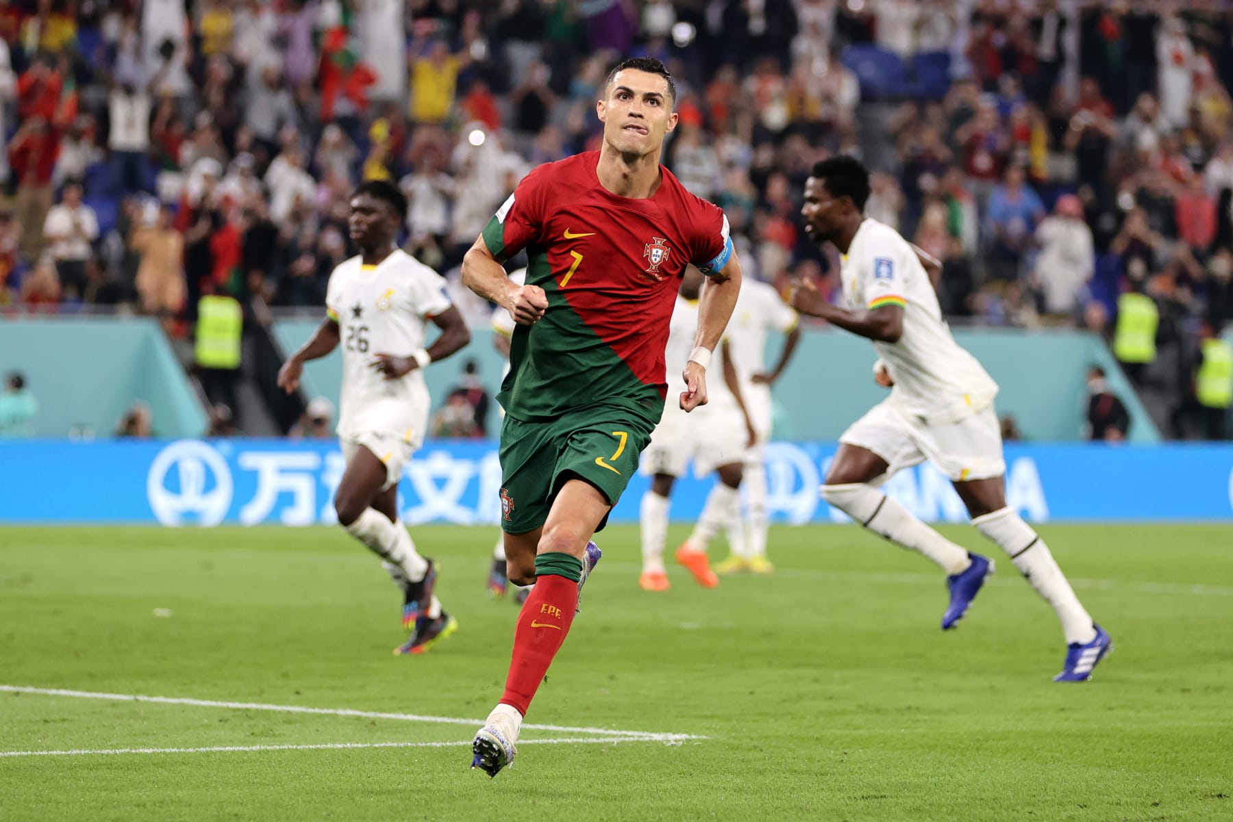DOHA, QATAR - NOVEMBER 24: Cristiano Ronaldo of Portugal celebrates after scoring their team's first goal via a penalty during the FIFA World Cup Qatar 2022 Group H match between Portugal and Ghana at Stadium 974 on November 24, 2022 in Doha, Qatar. (Photo by Clive Brunskill/Getty Images)