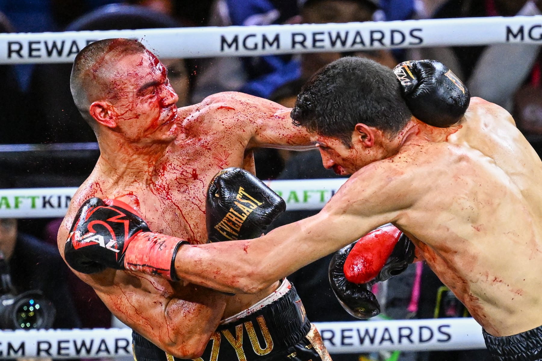 LAS VEGAS, NV - MARCH 30: (EDITORS NOTE: Image depicts graphic content) Tim Tszyu (in gold & black short) and Sebastian Fundora (in red & black short) exchange punches during their super welterweight world titles of the Premiere Boxing Championship on Saturday night as Sebastian Fundora wins at the T-Mobile Arena in Las Vegas, Nevada, United States on March 30, 2024. (Photo by Tayfun Coskun/Anadolu via Getty Images)